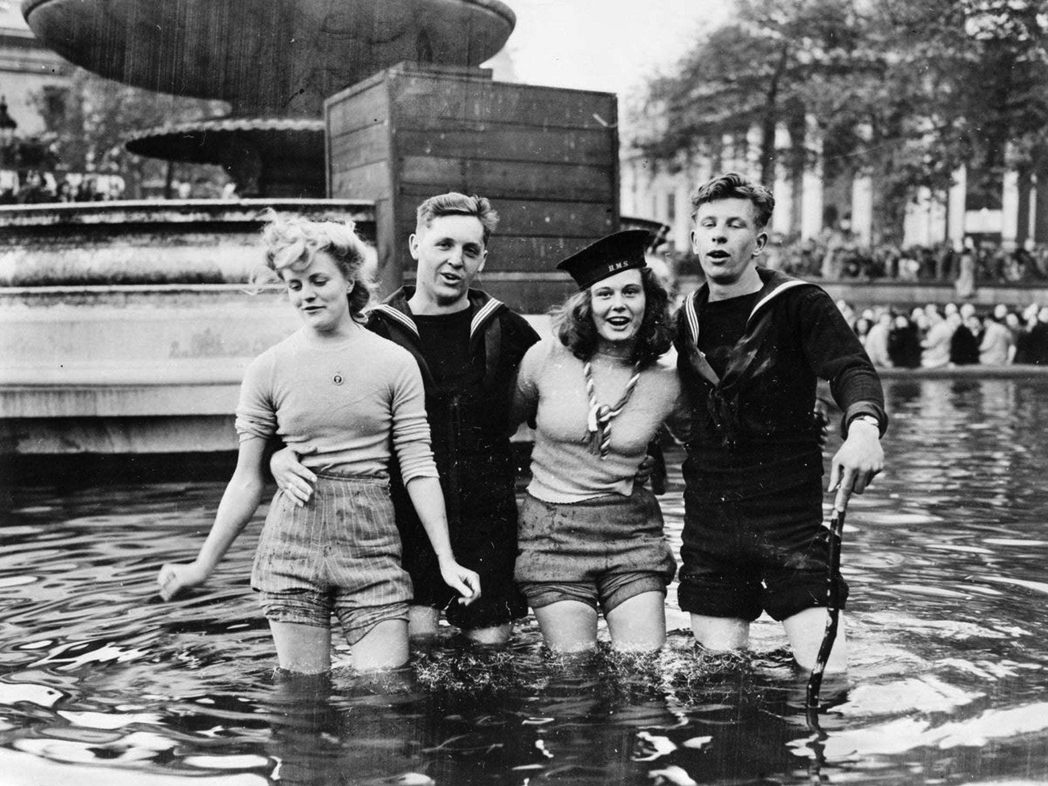 Joyce Digney (nee Brookes), left, with Cynthia Covello, celebrating VE Day with sailors in a fountain at Trafalgar Square on May 8 1945. Joyce Digney is now 89 and living in Canada