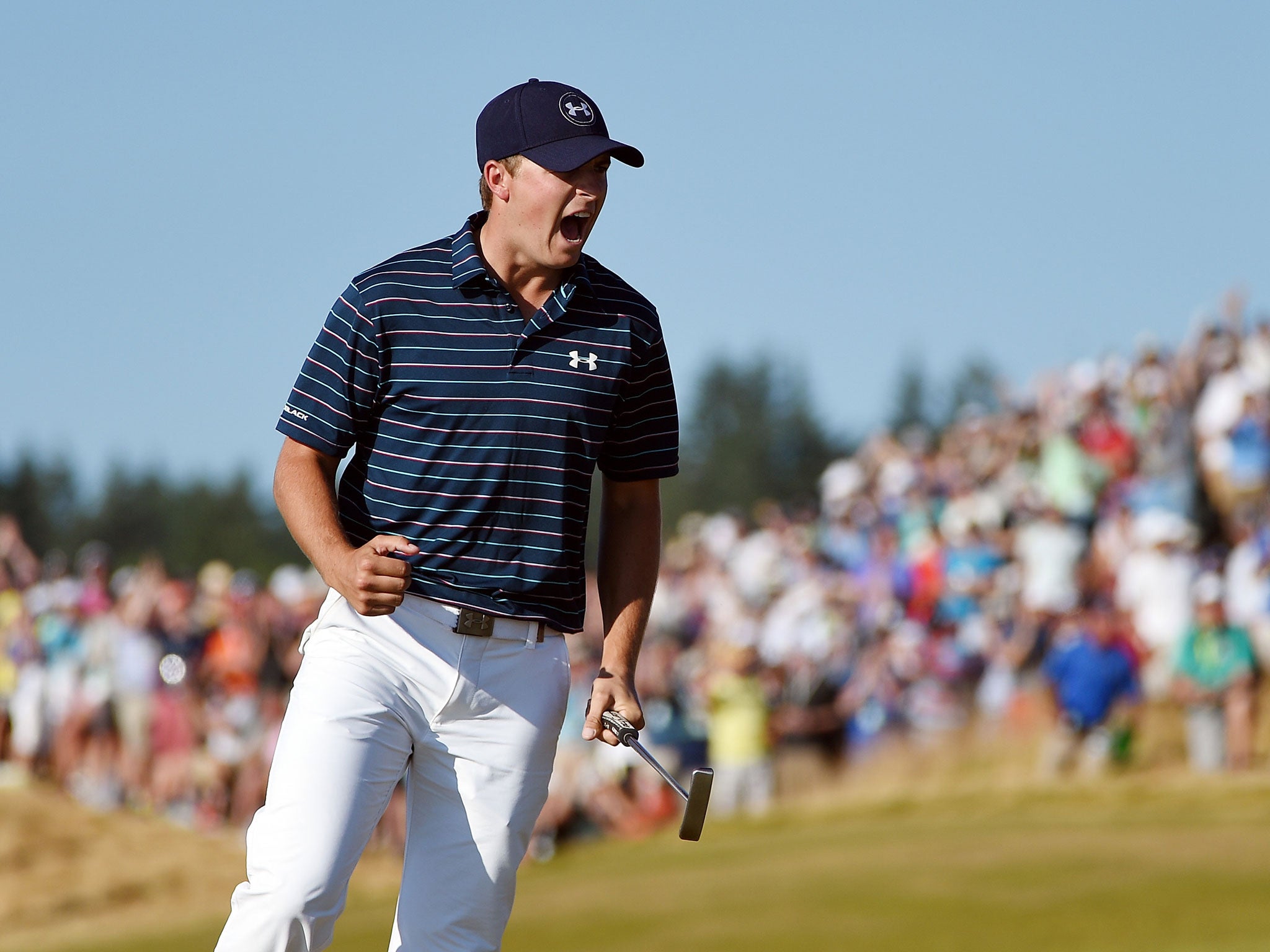 Spieth roars after putting in a birdie effort at 16