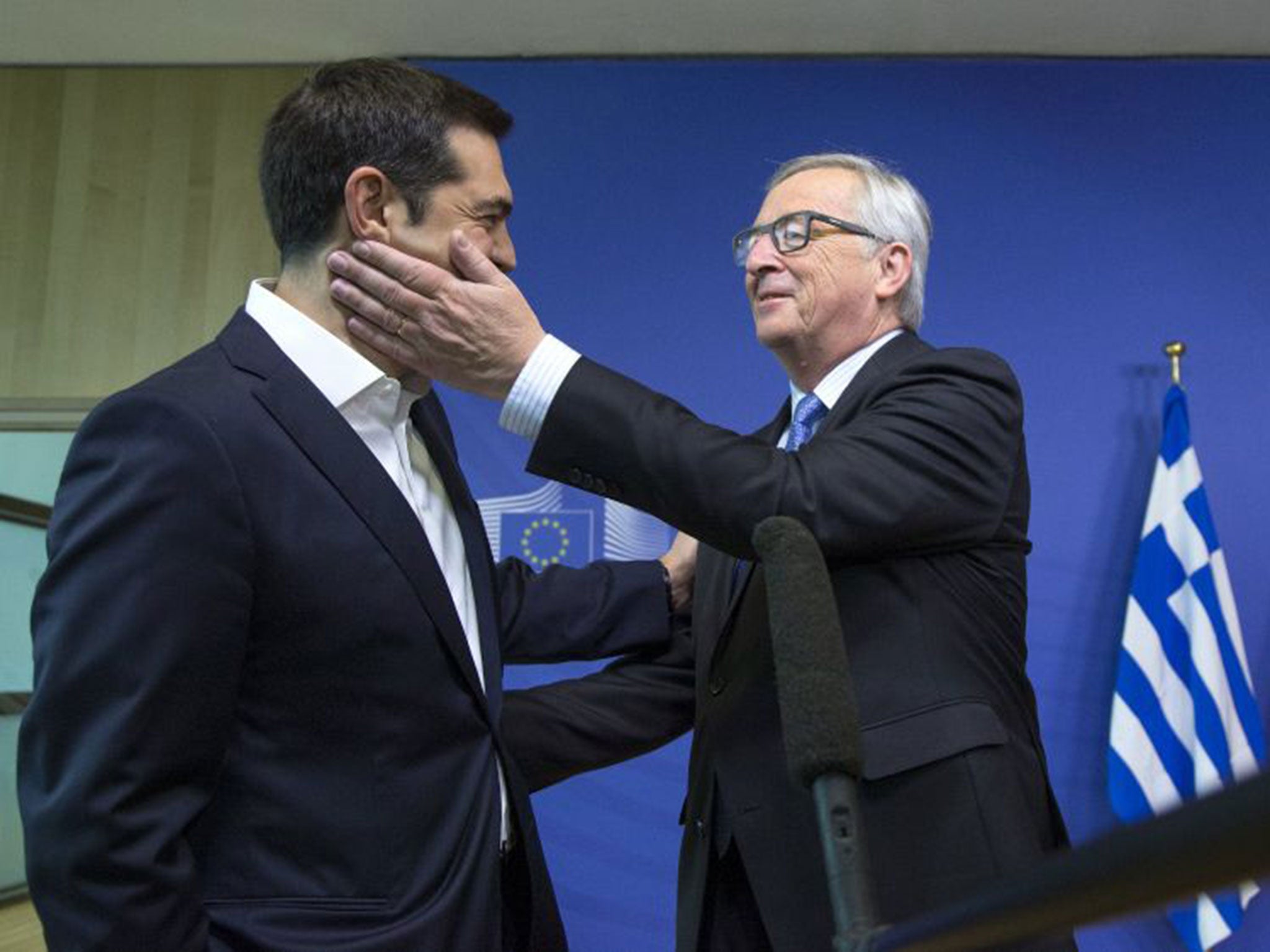 Greek Prime Minister Alexis Tsipras is welcomed by European Commission President Jean-Claude Juncker for a meeting ahead of a Eurozone emergency summit on Greece in Brussels, Belgium June 22.