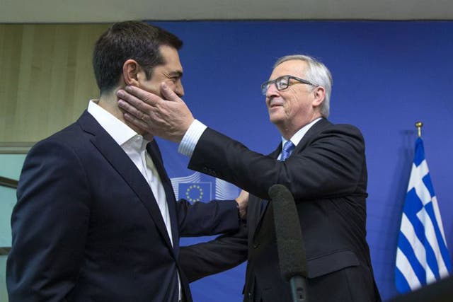 Greek Prime Minister Alexis Tsipras is welcomed by European Commission President Jean-Claude Juncker for a meeting ahead of a Eurozone emergency summit on Greece in Brussels, Belgium June 22, 2015. 