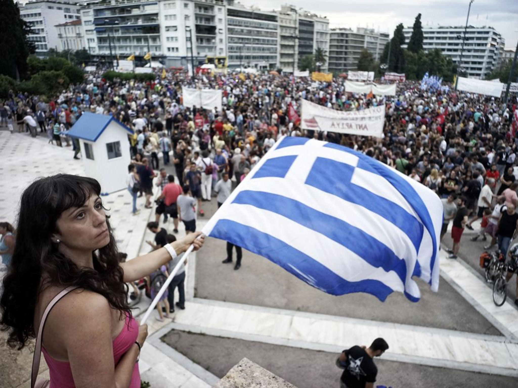 Protesters attend an anti-austerity pro-government rally in front of the parliament building