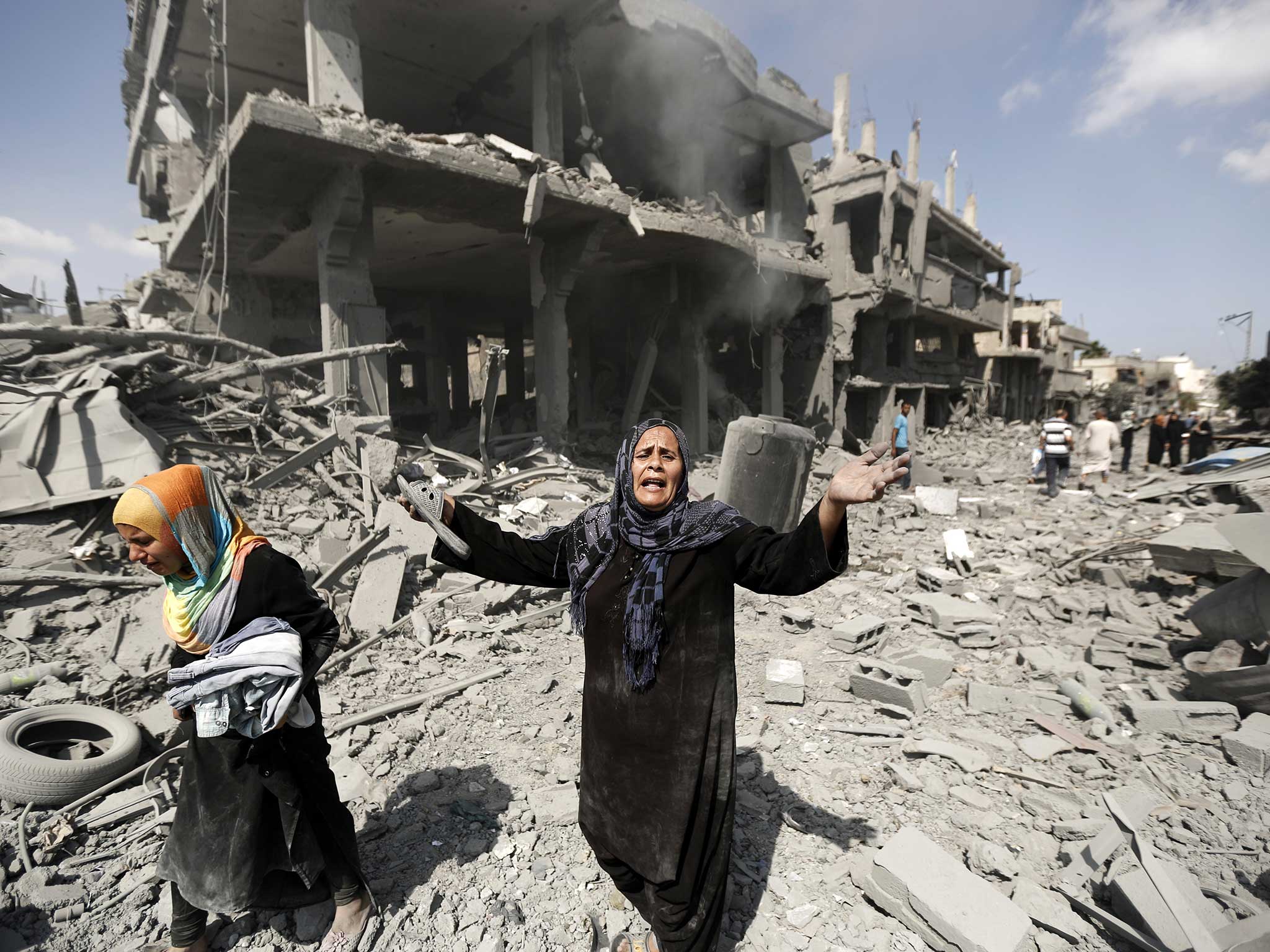 A woman cries to the camera during the 2014 hostilities