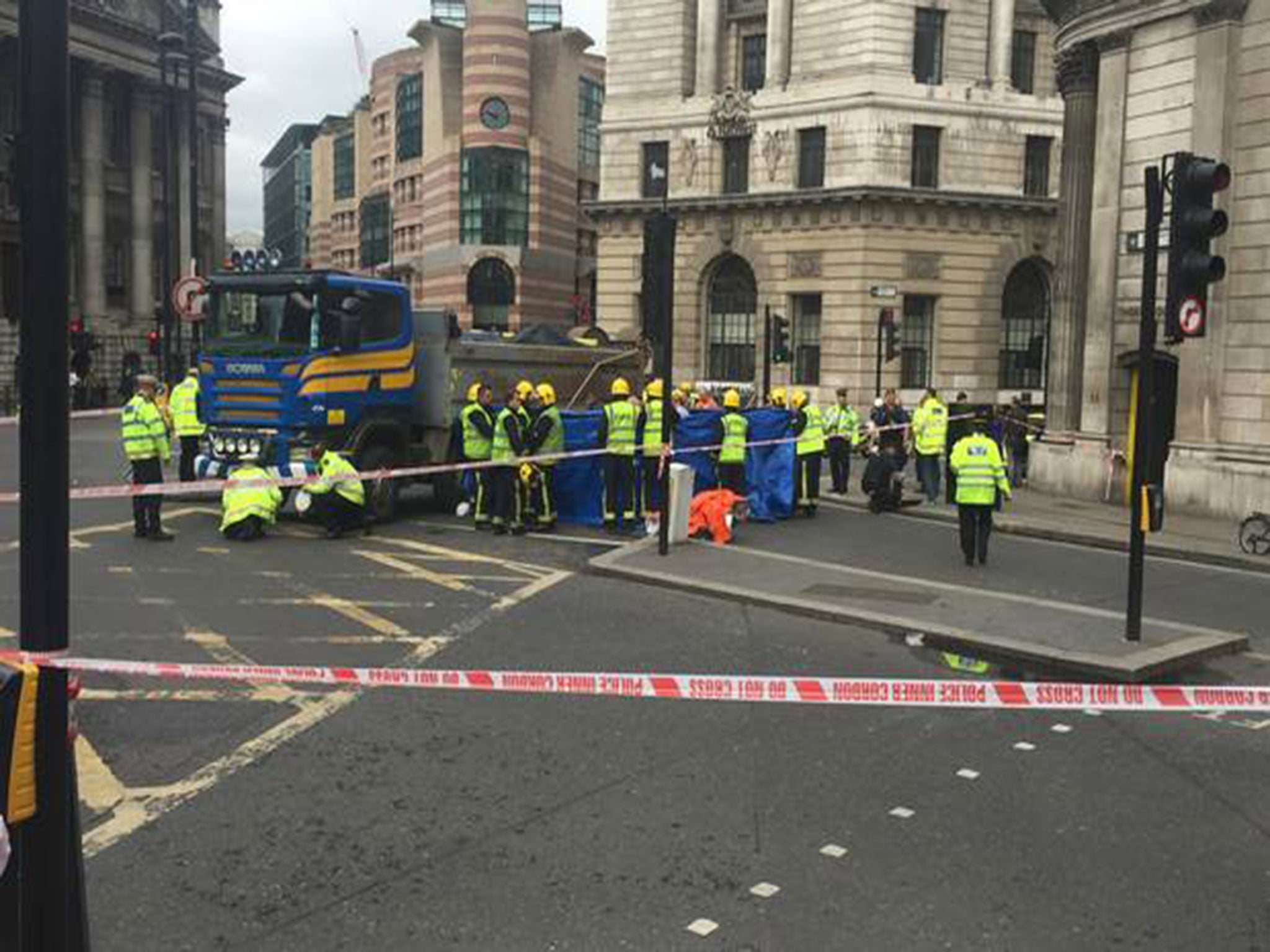 The woman, 26, has died after her bike collided with a tipper truck near the Bank of England