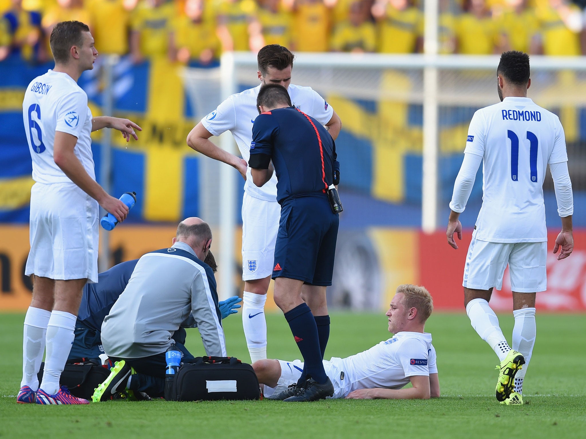 Alex Pritchard lies injured during the Uefa Under21 European Championship 2015 match between Sweden and England at Andruv Stadium