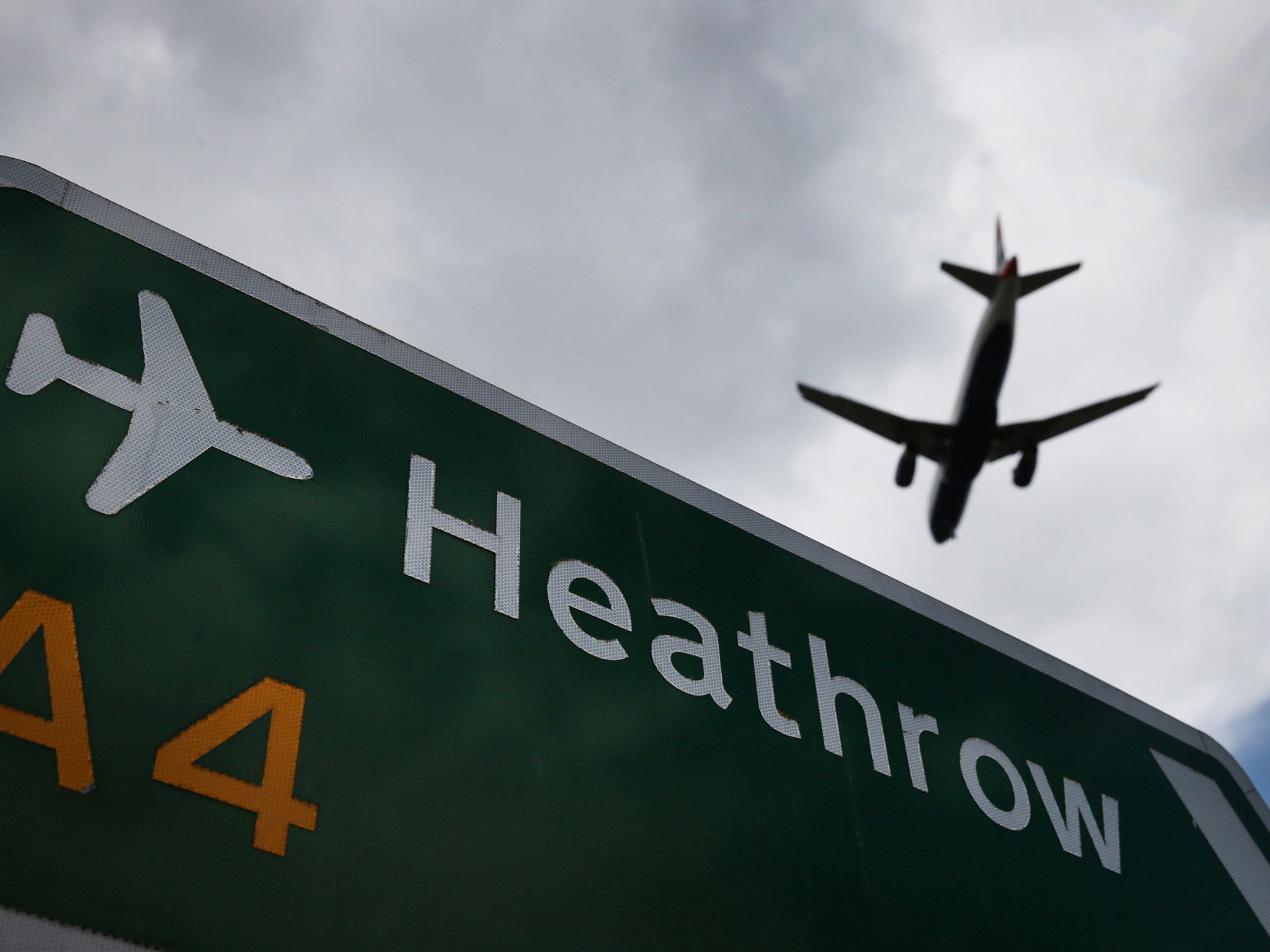 LONDON, ENGLAND - AUGUST 11: An airliner comes in to land at Heathrow Airport on August 11, 2014 in London, England. Heathrow is the busiest airport in the United Kingdom and the third busiest in the world. The airport's operator BAA wants to build a third runway to cope with increased demand.