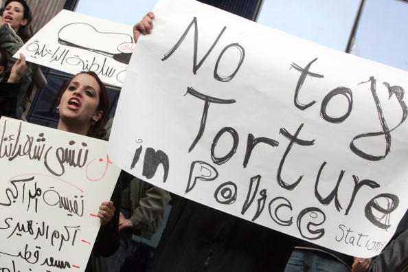 Egyptian human right activists protest against torture in police stations in Cairo