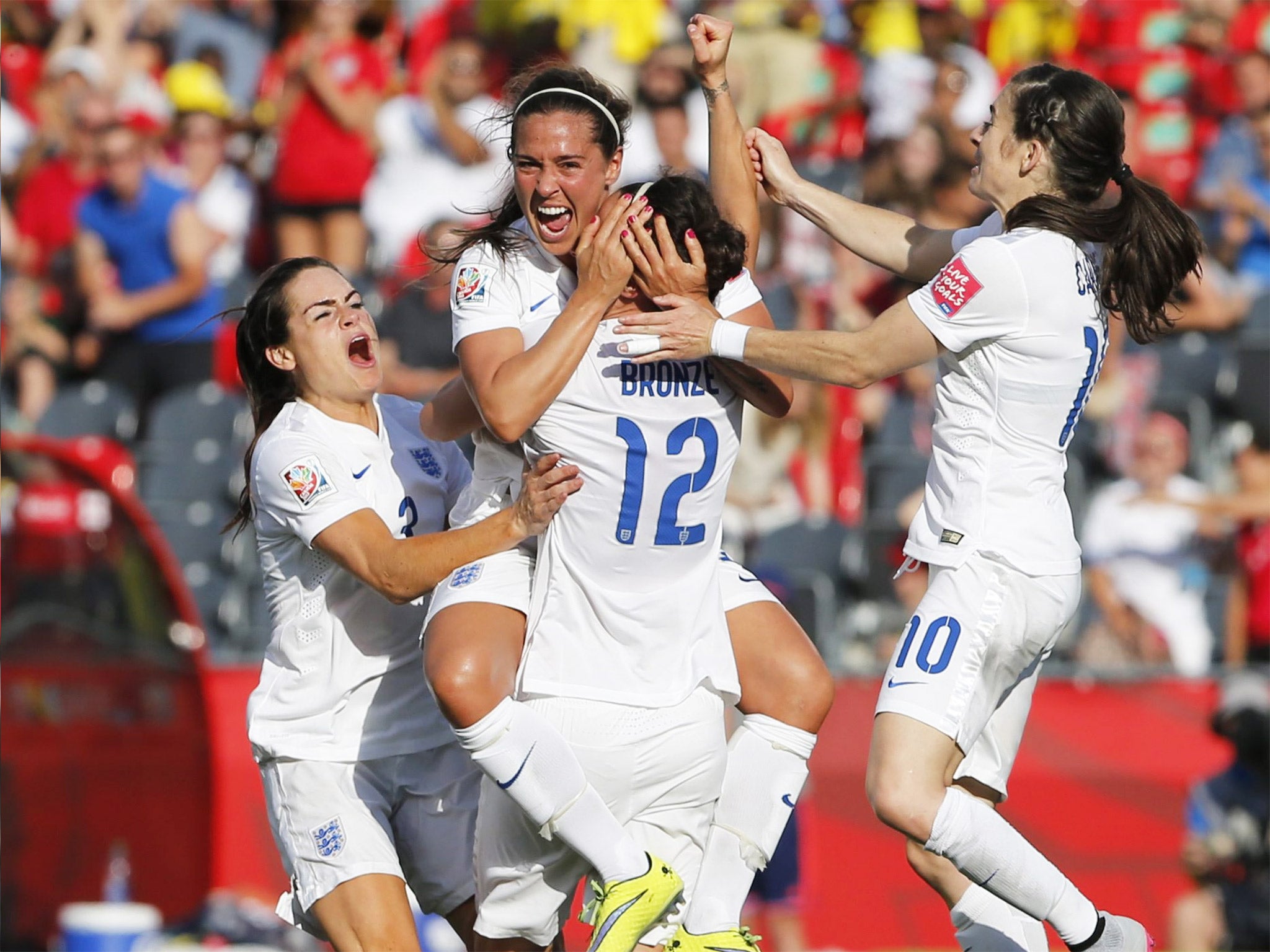 The England team celebrate after Lucy Bronze’s winning goal