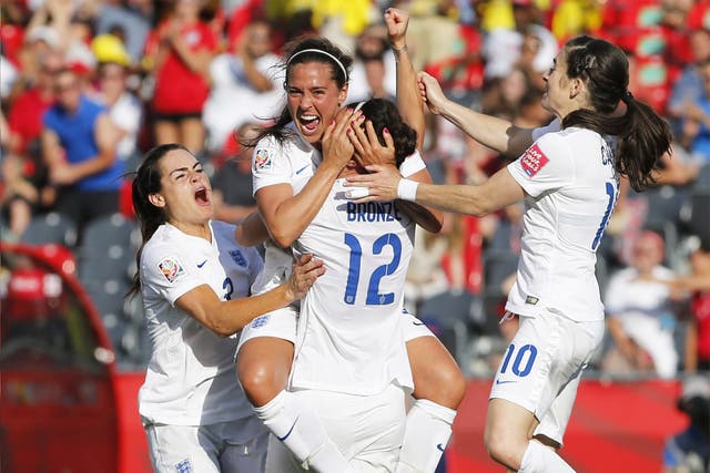 The England team celebrate after Lucy Bronze’s winning goal