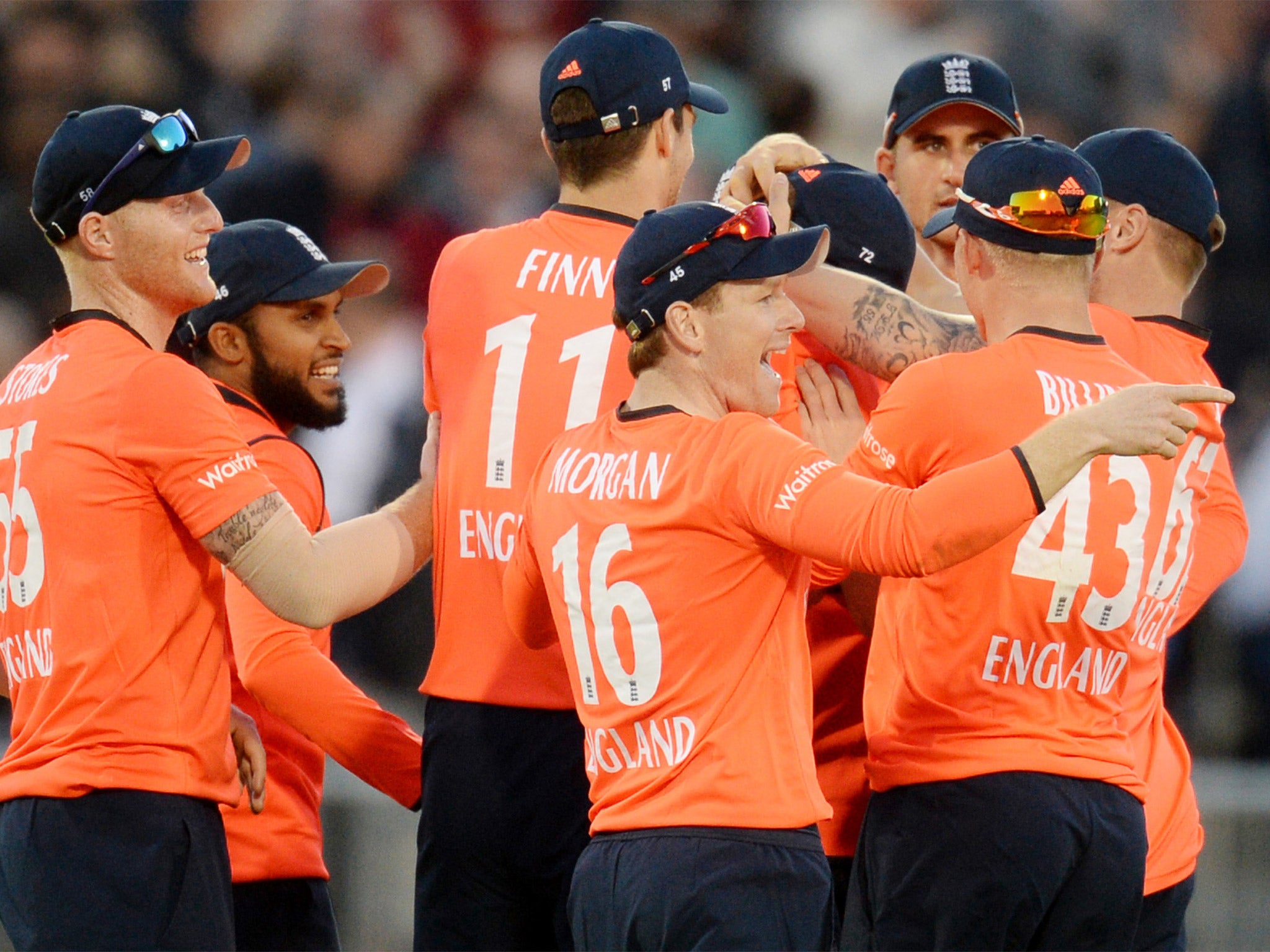 Eoin Morgan celebrates with his team-mates after Kane Williamson is run out as New Zealand lose five wickets in the space of 12 deliveries at Old Trafford