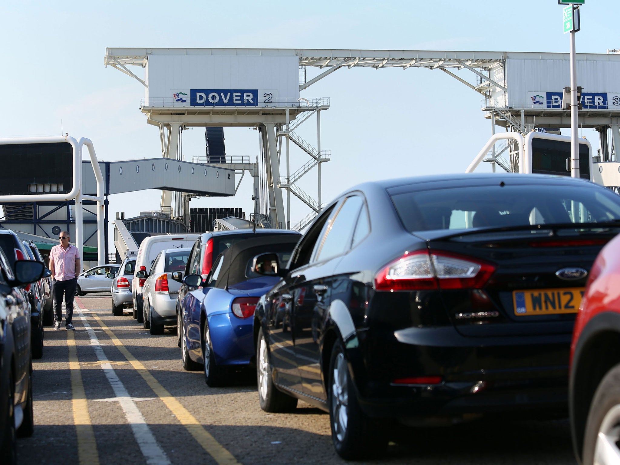 Cars queue to board a ferry in Dover bound for Dunkirk