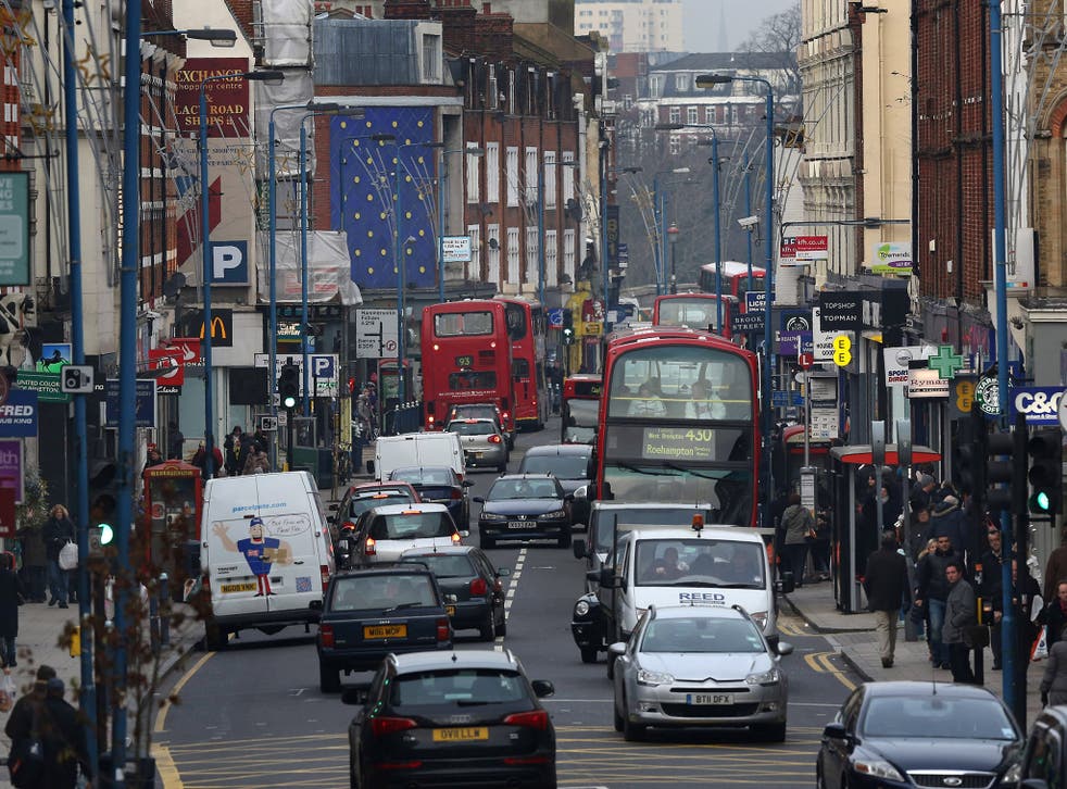 PUTNEY, ENGLAND - JANUARY 10: Traffic fills Putney High Street on January 10, 2013 in Putney, England. Local media are reporting environmental campaigners claims that levels of traffic pollutants, mostly nitrogen dioxide, have breached upper safe limits in the busy street in south west London.
