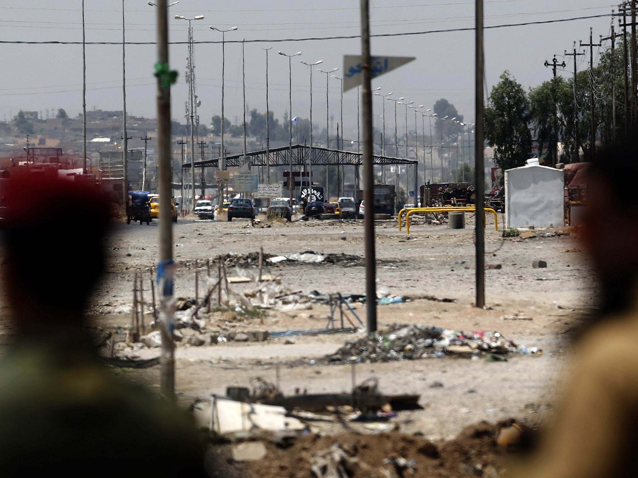 Kurdish troops watch Isis positions in Mosul