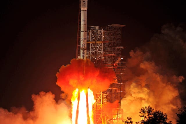 A Chinese rocket lifts off from the Xichang Satellite Launch Center in 2013. China insists that its space programme has peaceful purposes