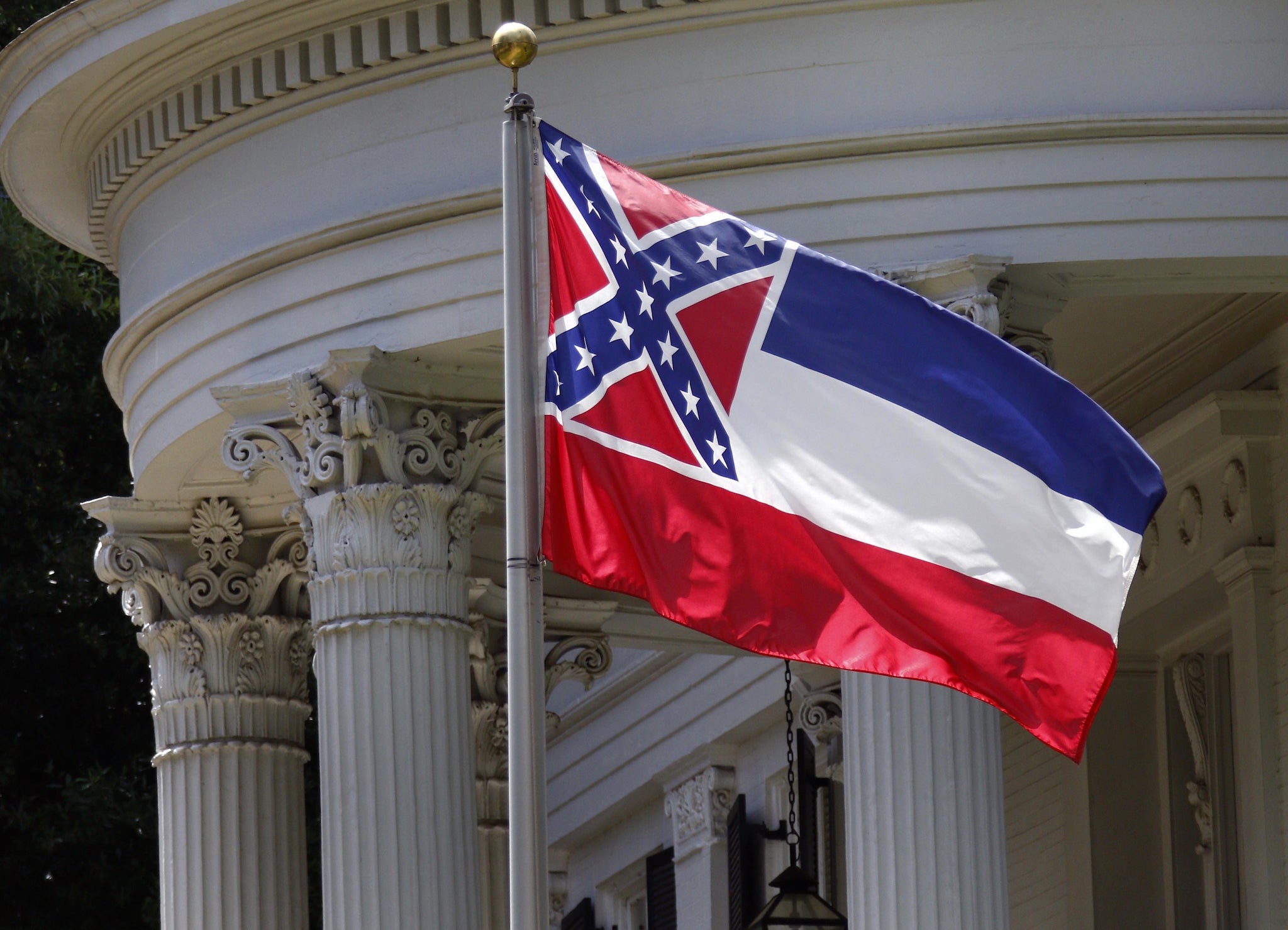 Mississippi's state flag flies in front of the Governor's Mansion in Jackson, Mississippi on 23 June 2015.