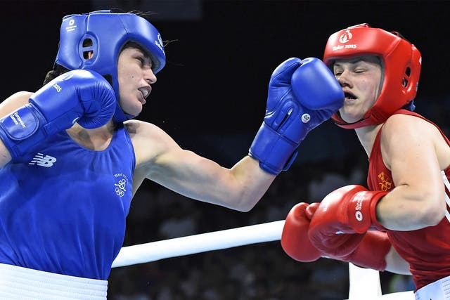 Katie Taylor lands a left hand on her opponent's face during her quarter-final victory