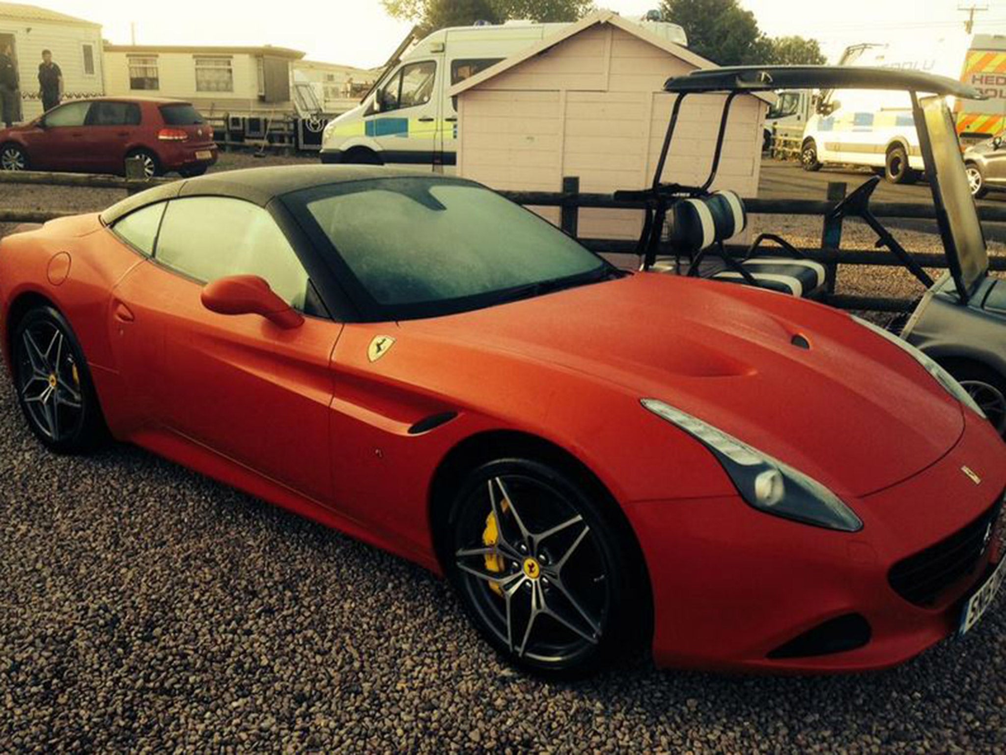 A red Ferrari California T was among the cars seized by Welsh police