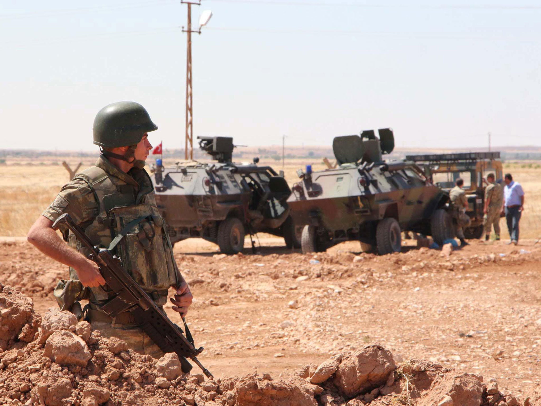 Turkish soldiers guard near Turkish-Syria border line after renewed attack by Islamic State in Kobane