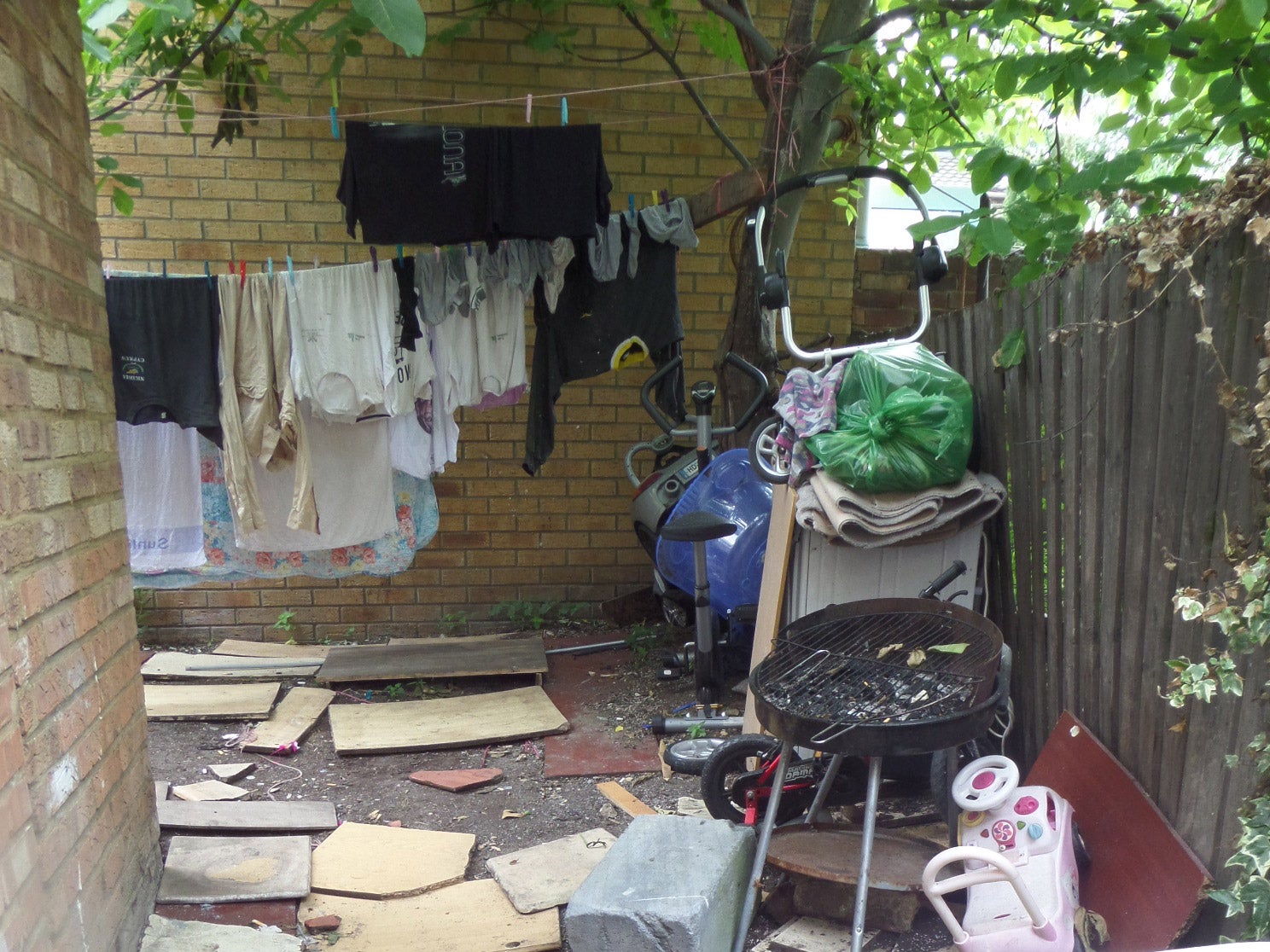 Back garden of the East Ham property which raised suspicions about over crowding after complaints of excess rubbish