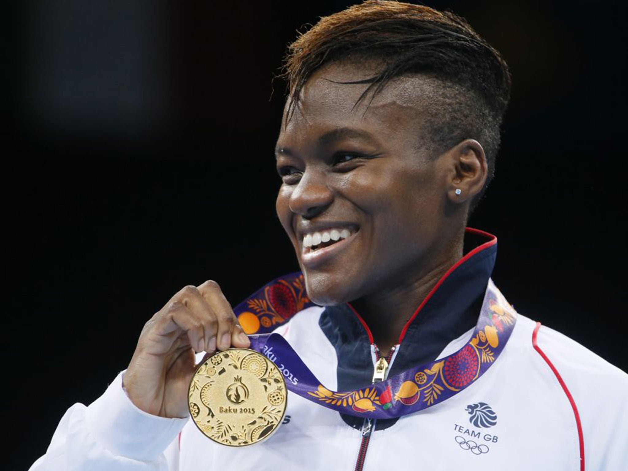 Nicola Adams celebrates with her gold medal after defeating Poland’s Sandra Drabik in the final
