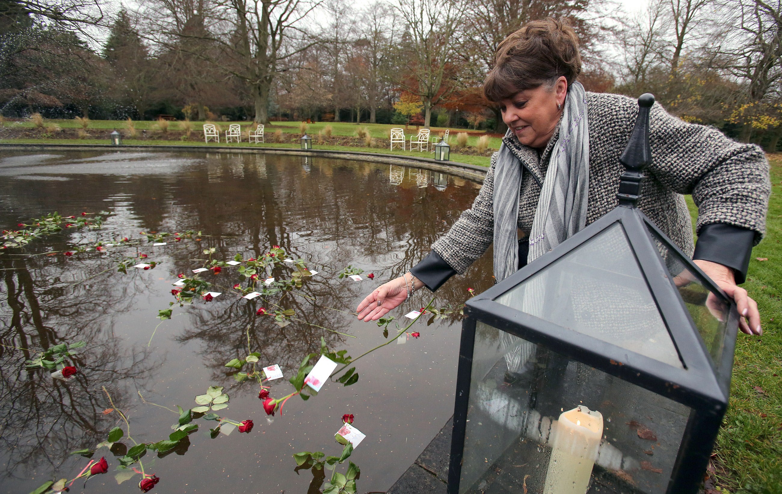 Maria Lynskey, niece of Joe Lynskey, pictured laying a rose in December 2014 at a memorial in honour of the Disappeared