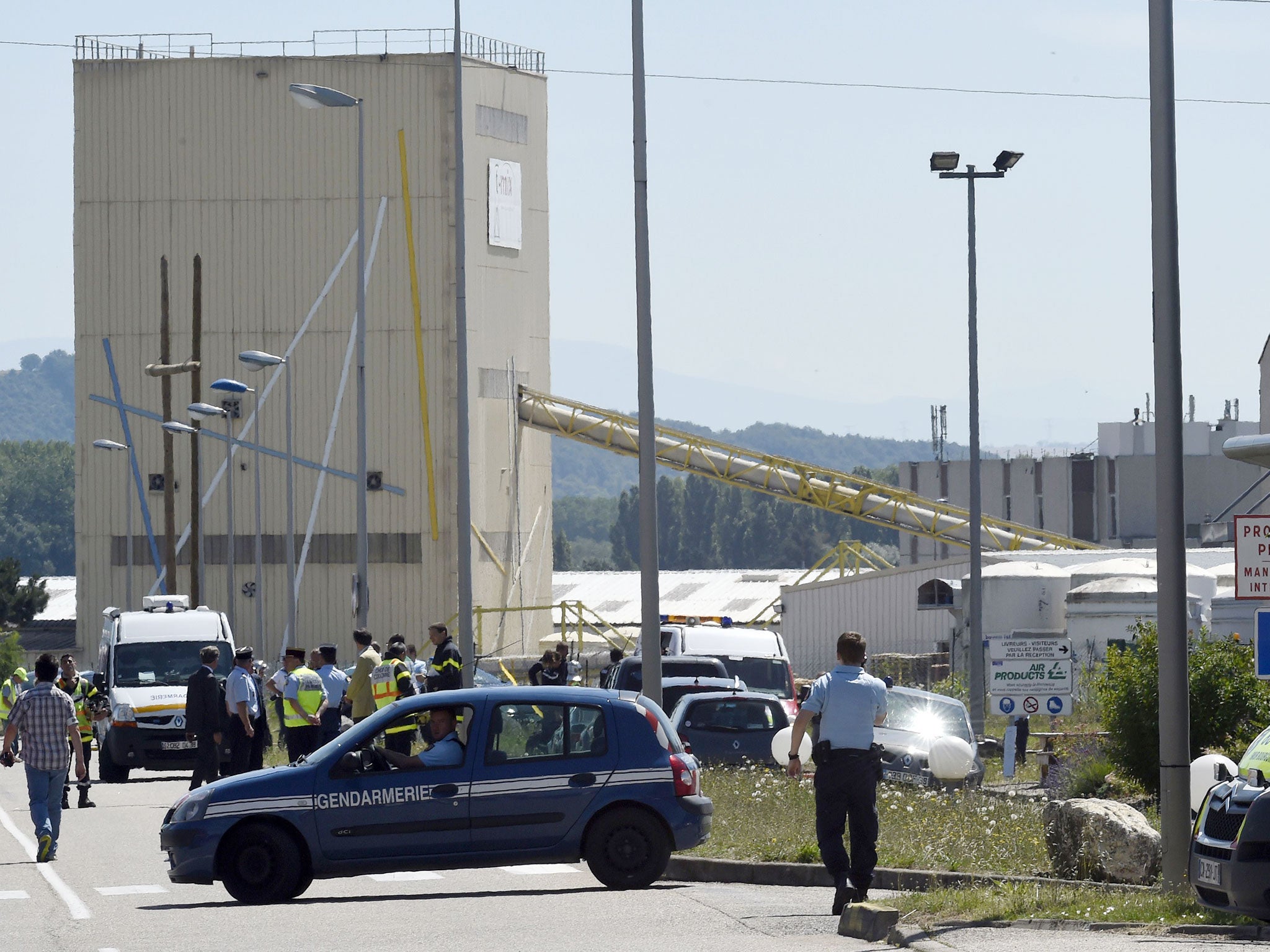 French security and emergency services gather at the entrance of the Air Products company in Saint-Quentin-Fallavier, near Lyon