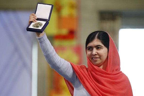 'Thank you to my father for not clipping my wings and for letting me fly' - Malala shows her medal during the Nobel Peace Prize awards ceremony in Oslo last year