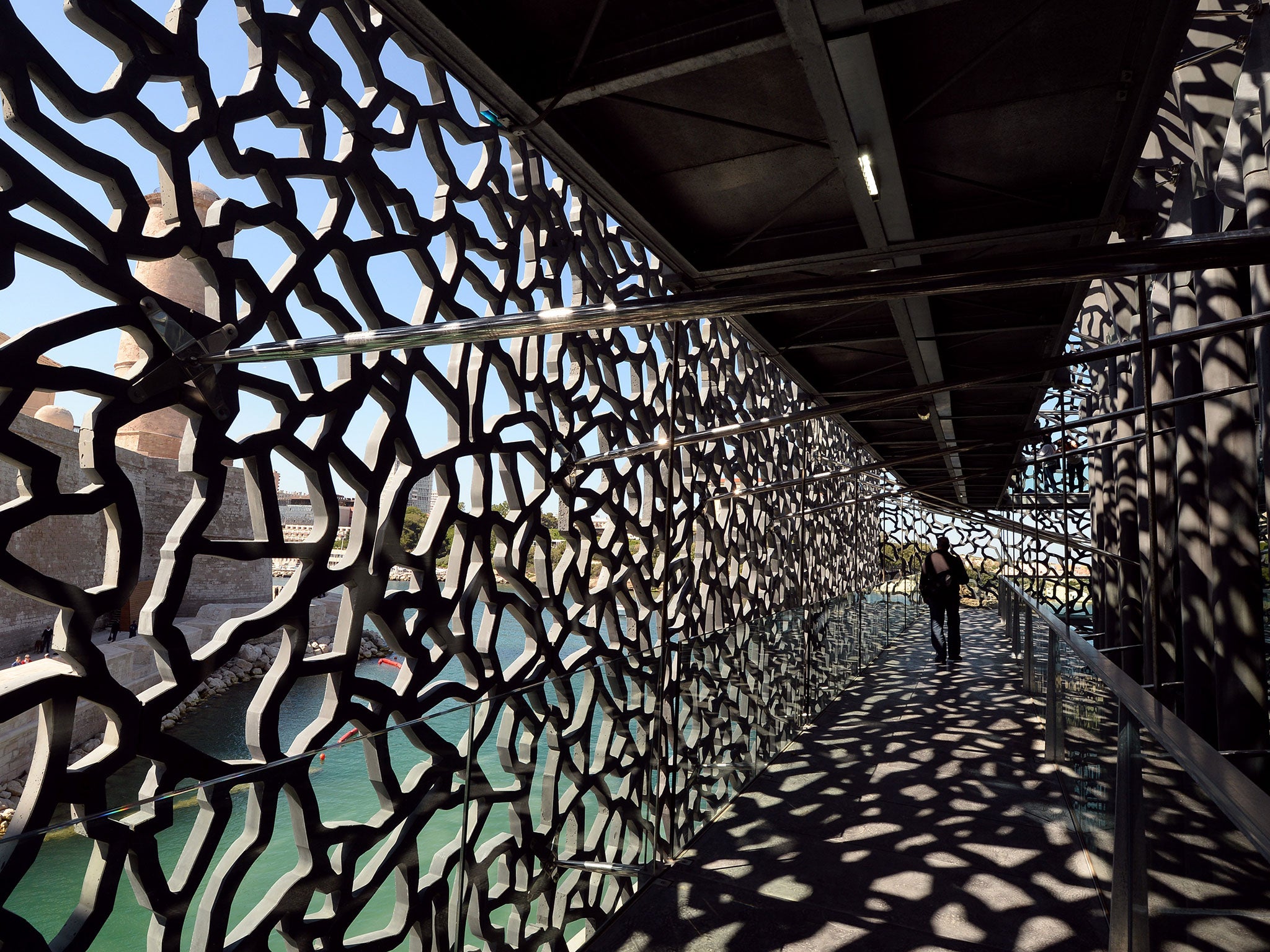 A person walks on June 3, 2013 in a passageway of the MuCEM, the Museum of Civilisations from Europe and the Mediterranean in Marseille on the eve of its opening by the French President
