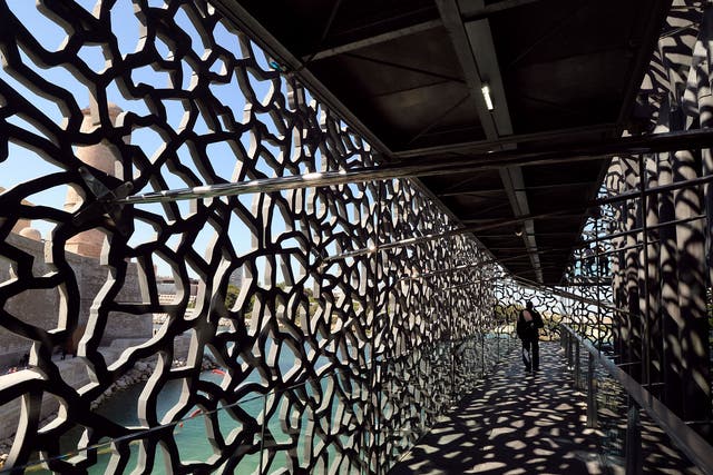 A person walks on June 3, 2013 in a passageway of the MuCEM, the Museum of Civilisations from Europe and the Mediterranean in Marseille on the eve of its opening by the French President
