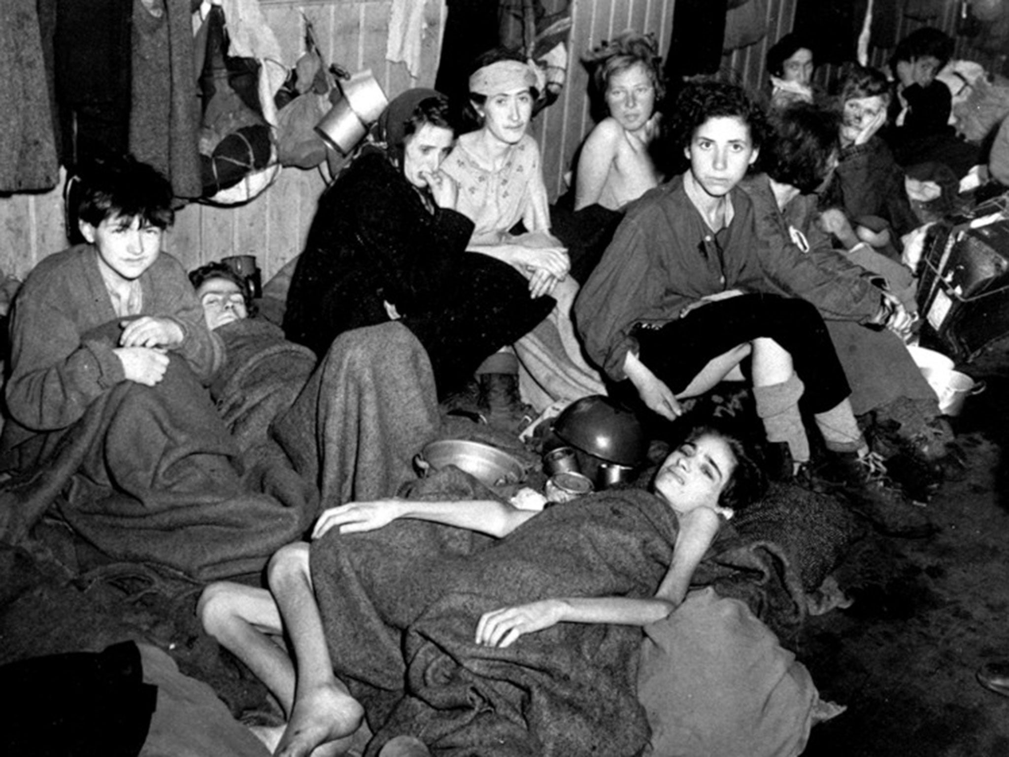 Women and children, some of over 40,000 concentration camp inmates liberated by the British