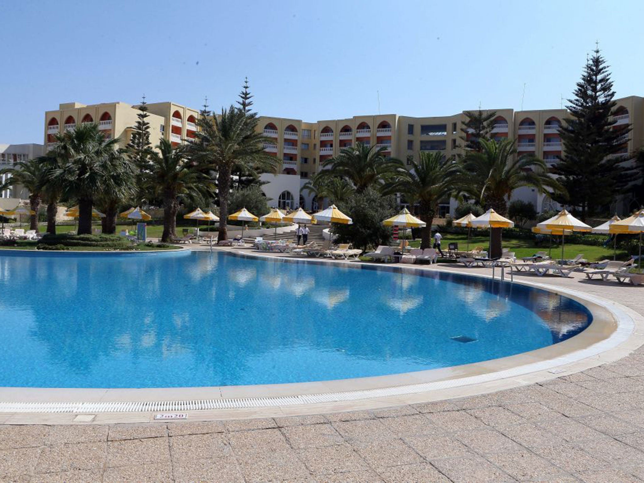 A general view of the deserted pool and deck chairs at the Imperial Marhaba Hotel