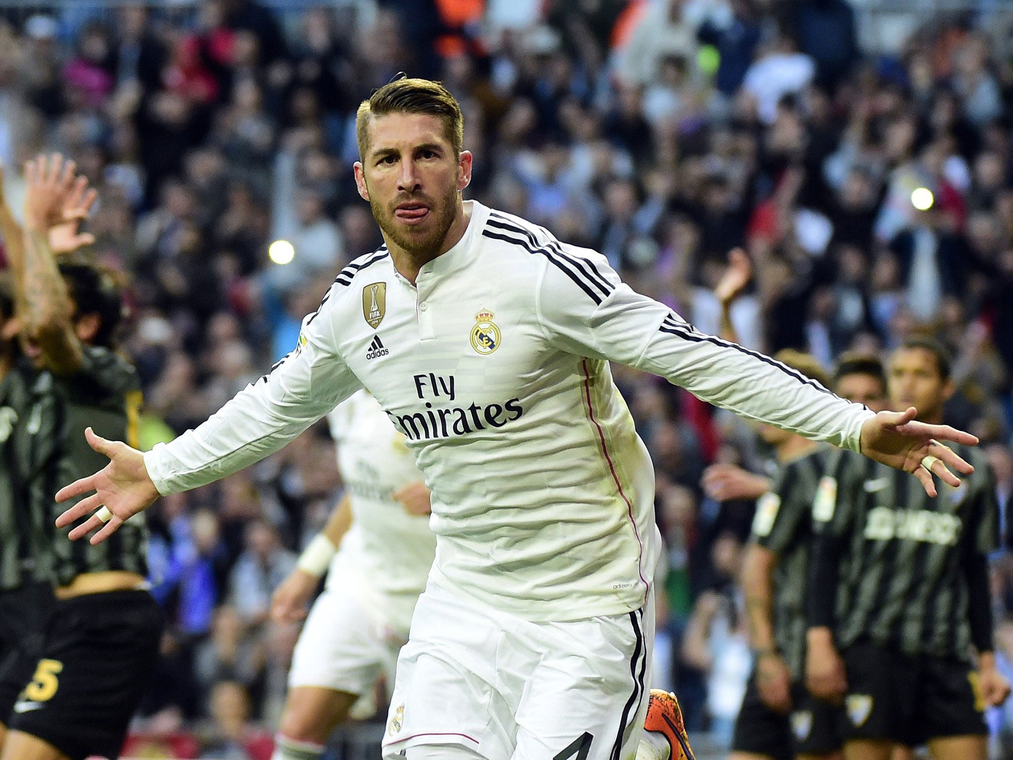 Real Madrid's Sergio Ramos celebrates after scoring against Malaga FC 