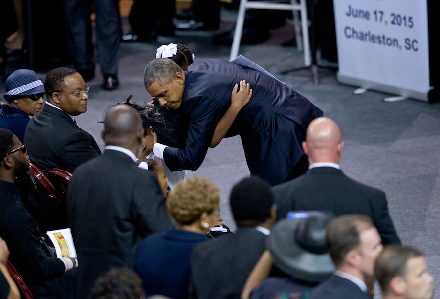&#13;
President Barack Obama embraces Eliana Pinckney, daughter of Rev. Clementa Pinckney after speaking during services honoring the life of of her father Friday. Associated Press&#13;