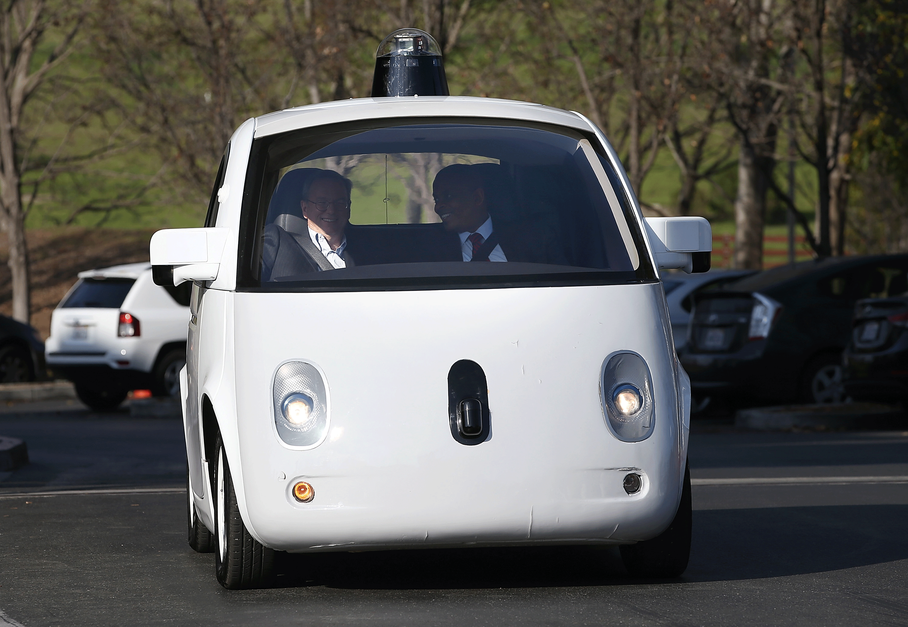 MOUNTAIN VIEW, CA - FEBRUARY 02: U.S. Transportation Secretary Anthony Foxx (R) and Google Chairman Eric Schmidt (L) ride in a Google self-driving car at the Google headquarters on February 2, 2015 in Mountain View, California. U.S. Transportation Secreta