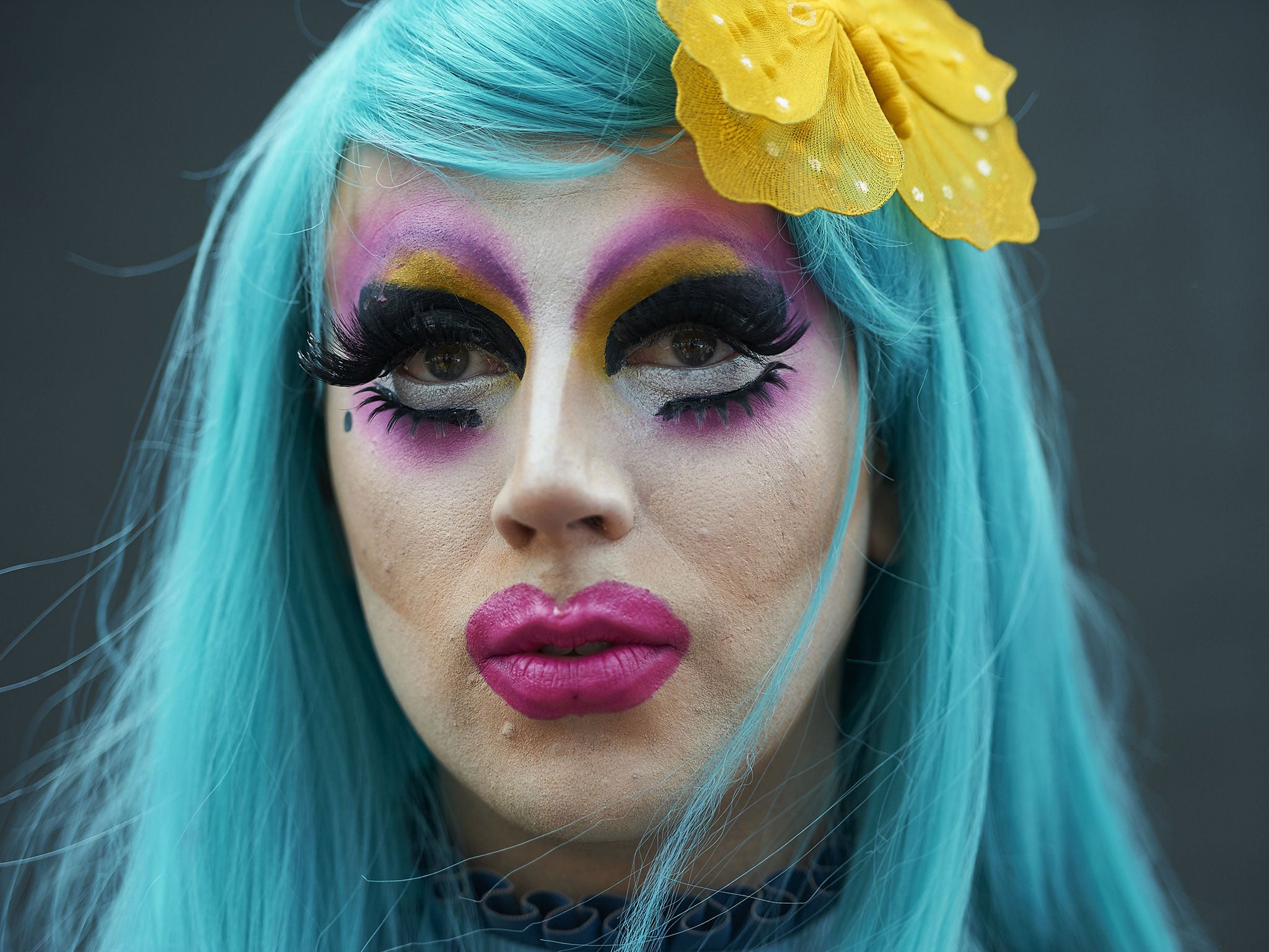 A member of the Lesbian, Gay, Bisexual and Transgender (LGBT) community takes part in the annual Pride Parade in London