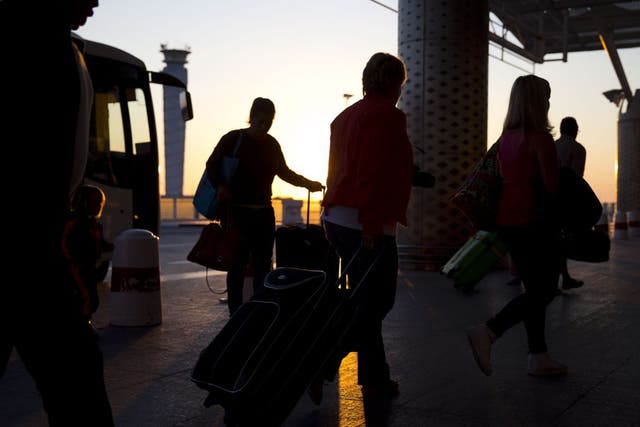 Tourists wait to leave Tunisia at Enfidha International Airport on Saturday