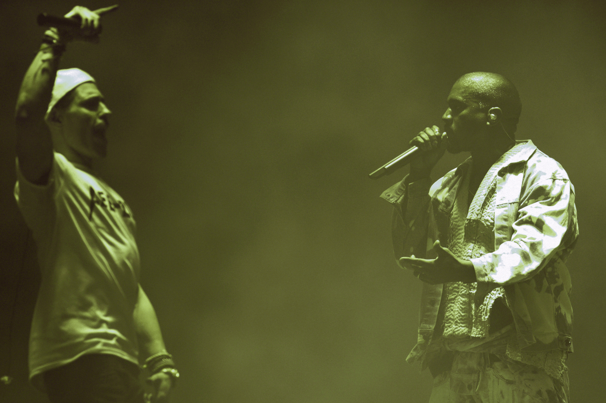 Lee Nelson invades the stage during Kanye West's headline slot at Glastonbury 2015