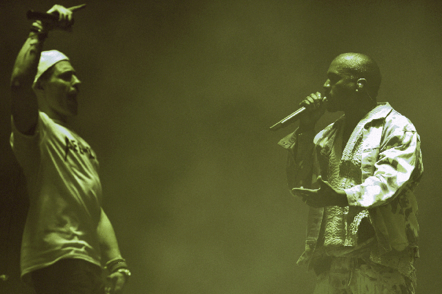 Lee Nelson invades the stage during Kanye West's headline slot at Glastonbury 2015