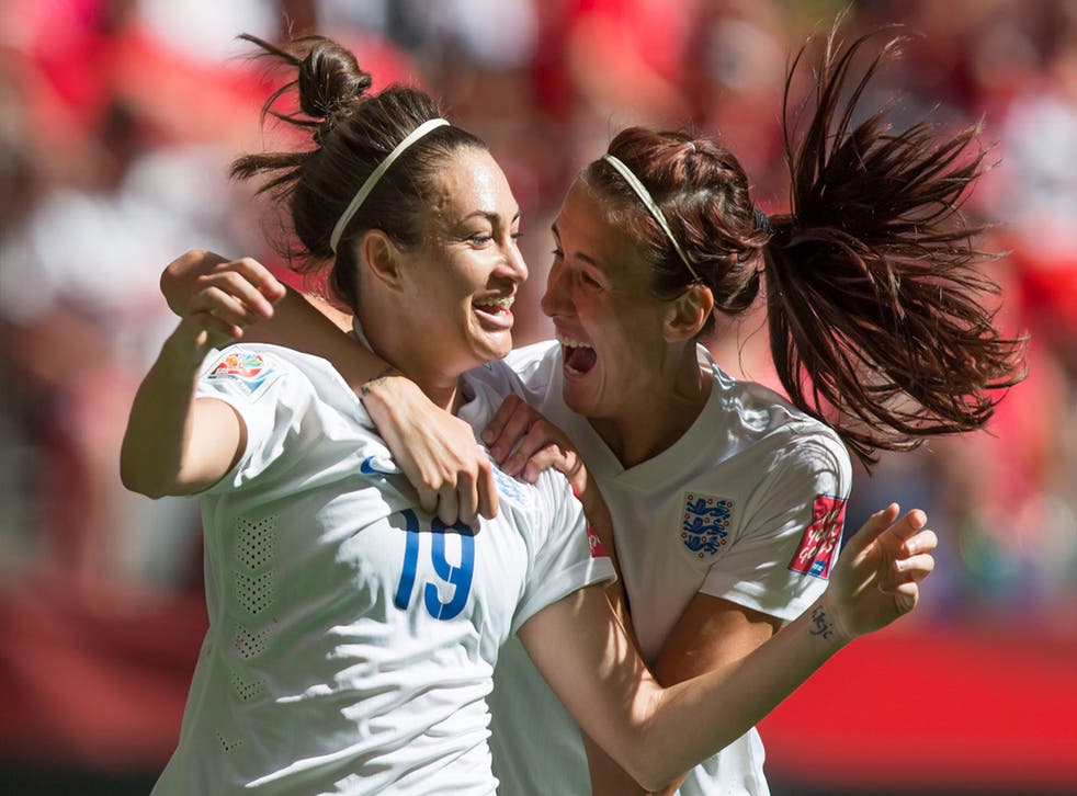 England's Jodie Taylor, left, and Jill Scott celebrate Taylor's goal against Canada during the first half in a quarterfinal of the Women's World Cup