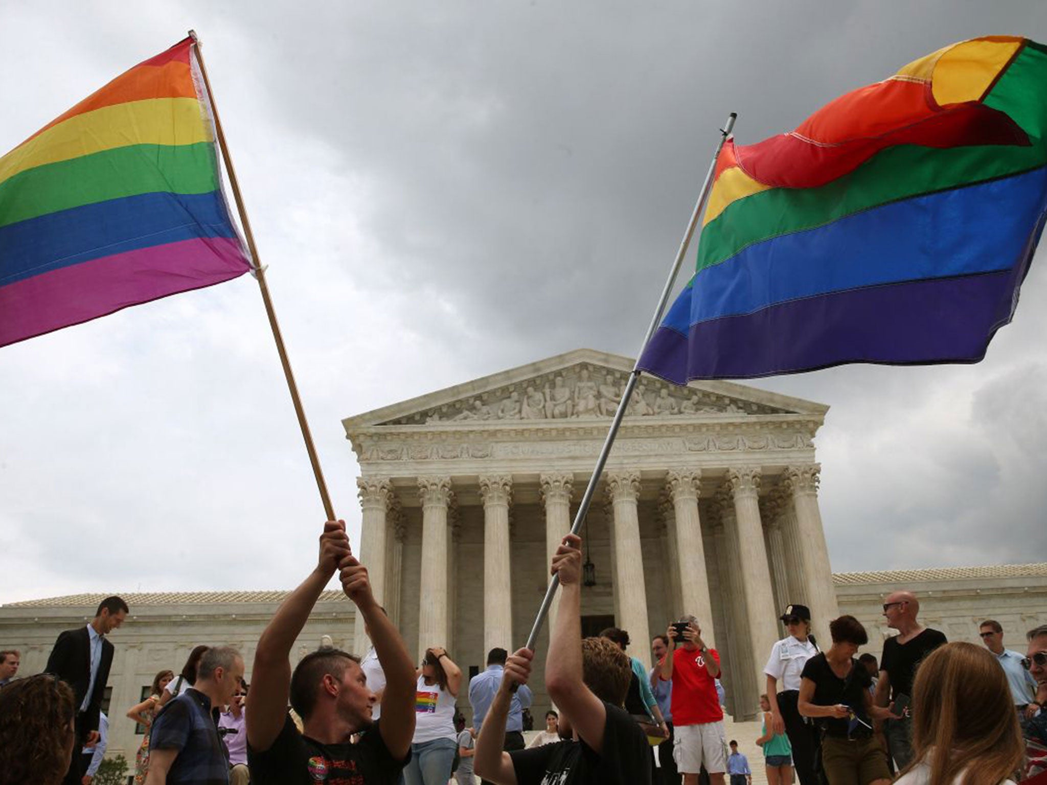 People celebrate in front of the U.S. Supreme Court after the ruling in favor of same-sex marriage June 26, 2015 in Washington, DC