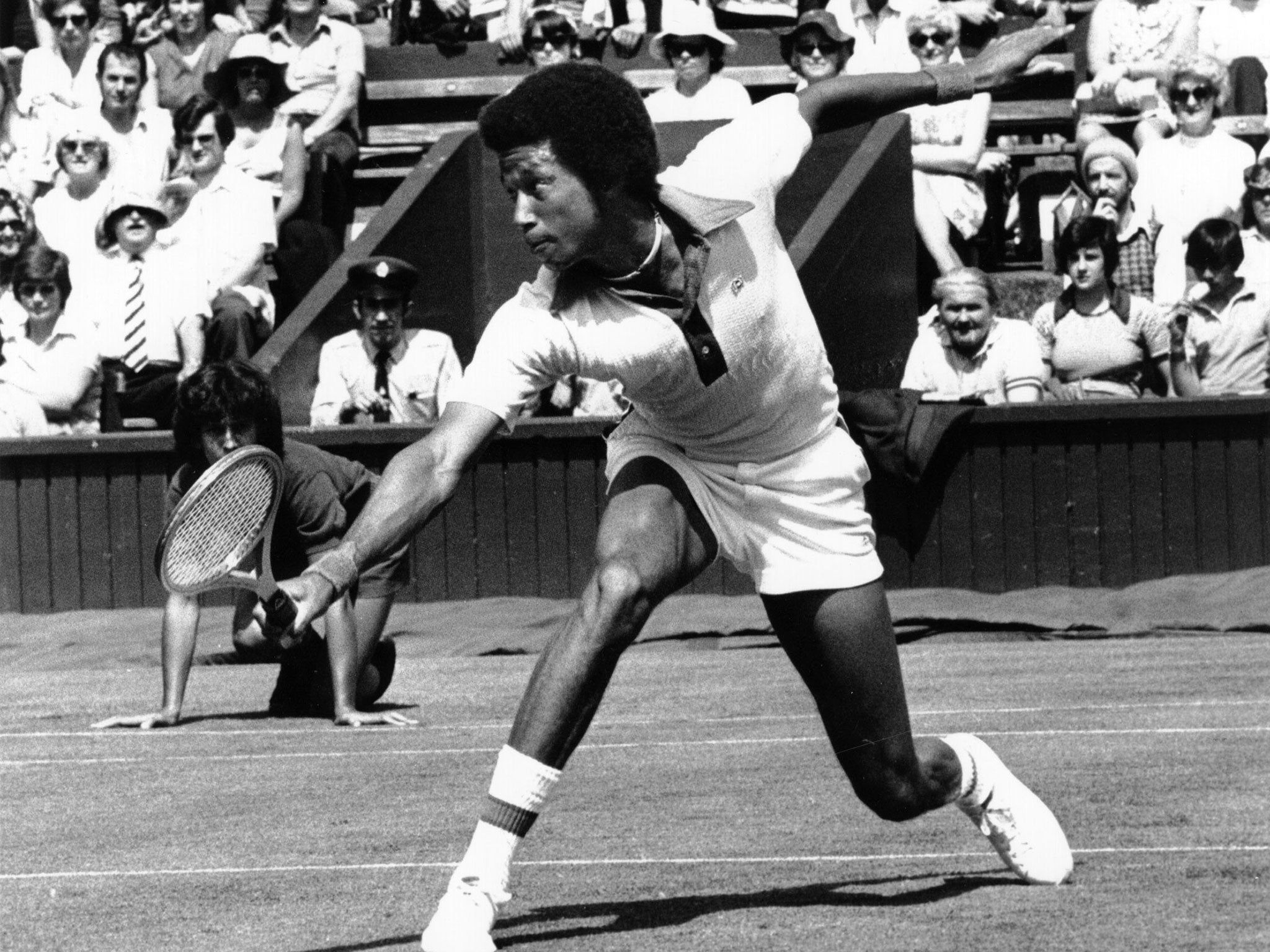 Arthur Ashe plays a backhand at Wimbledon back in 1975