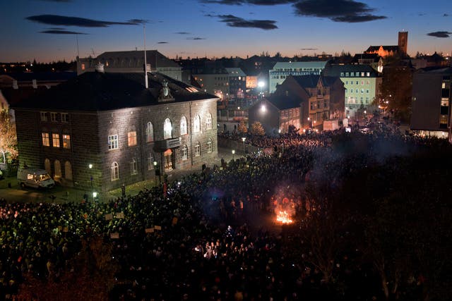 A crowd of people outside parliament in Iceland in 2010