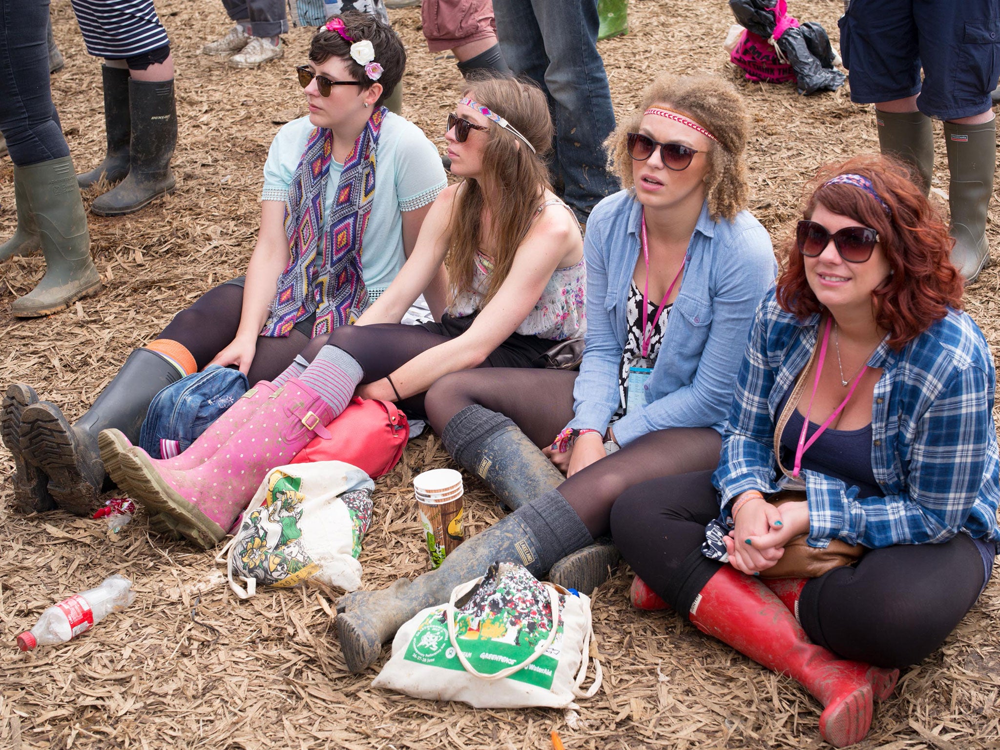 Festival goers enjoy the atmosphere at the Glastonbury Festival at Worthy Farm, Pilton