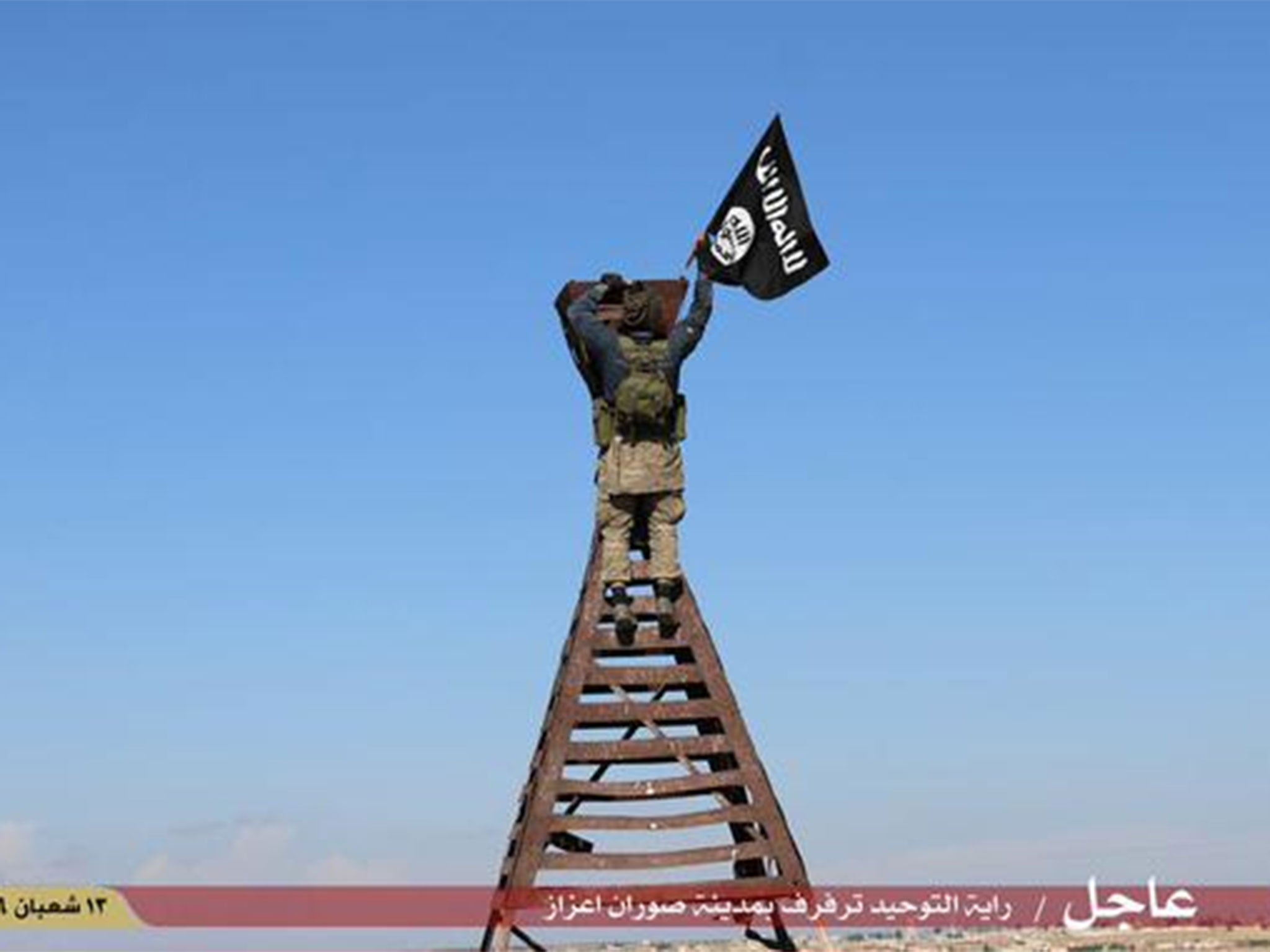 An Isis propaganda image of its flag being raised in the town of Soran Azaz