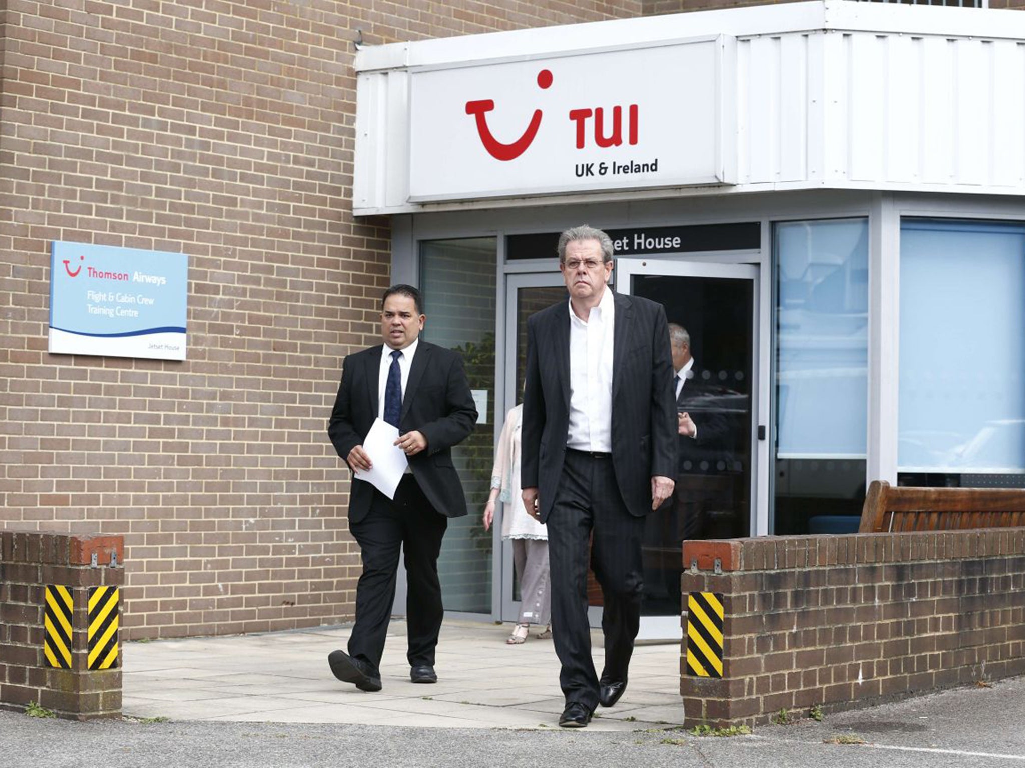 Peter Long, left, joint chief executive of the TUI Group, and Nick Longman, managing director of the TUI Group made a statement to the media on Saturday