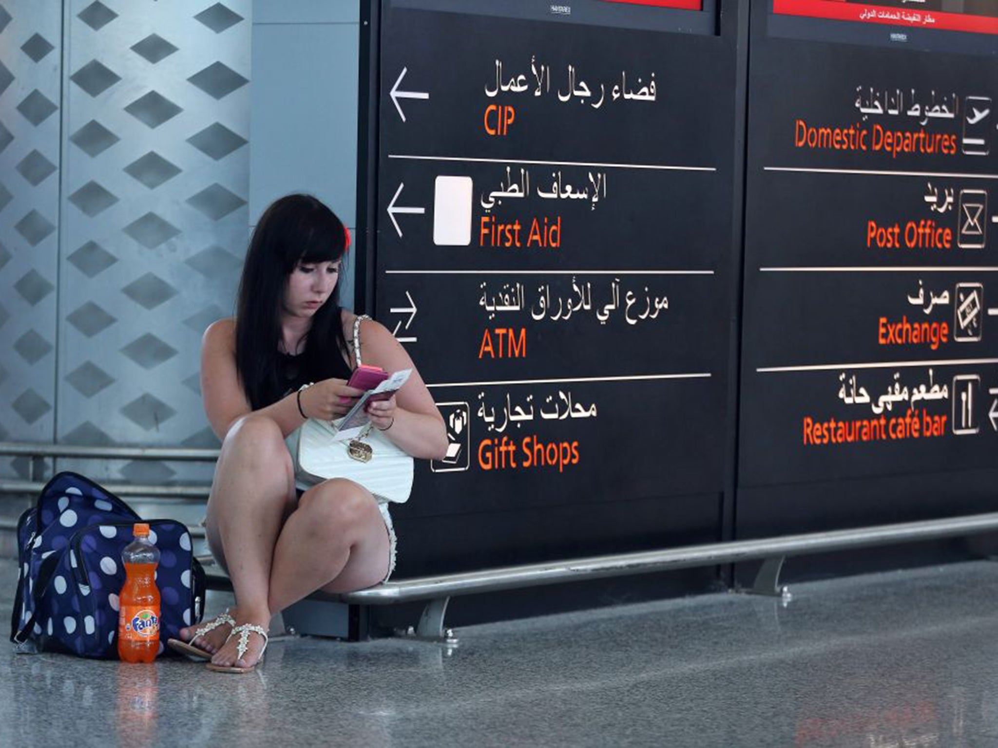 A British holidaymaker waits at Enfidha airport in Sousse. The big tour operators and airlines are attempting to bring back customers who want to head home early after the attack (EPA)