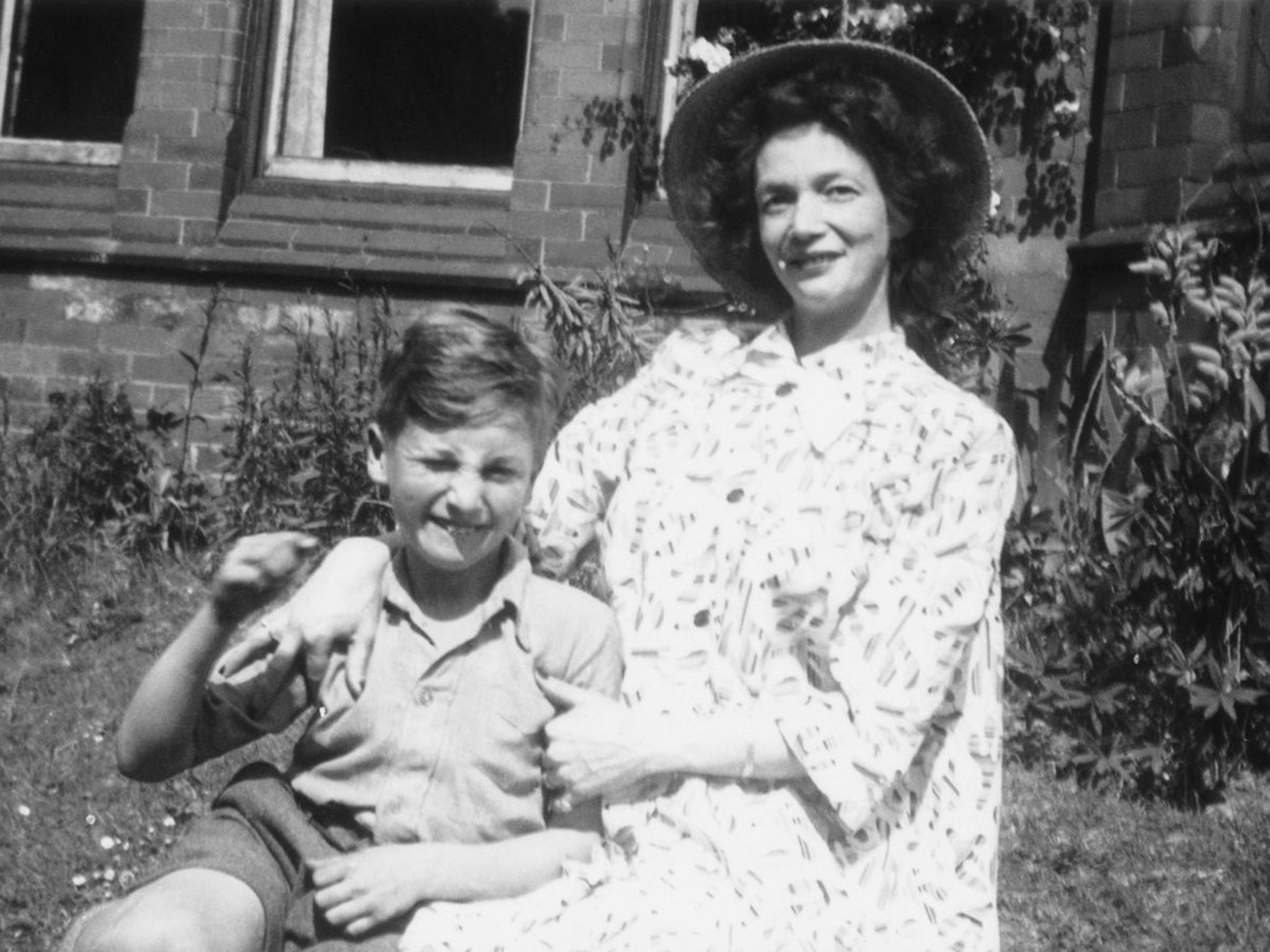 Singer, songwriter and musician John Lennon with his mother Julia Lennon in 1949