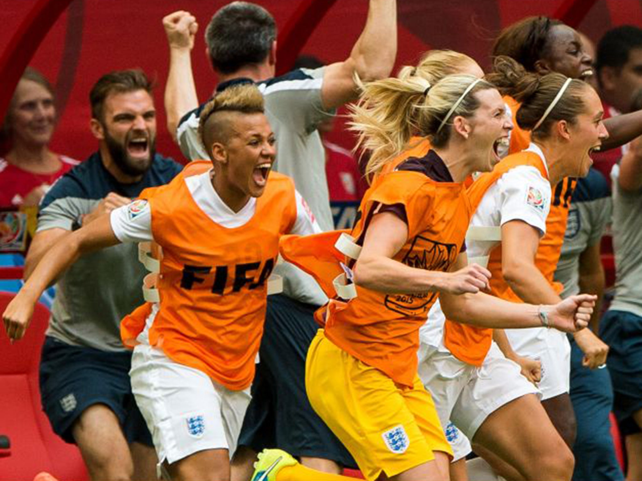 England players and coaching staff celebrate their quarter-final victory over host nation Canada at the Women’s World Cup early on Sunday