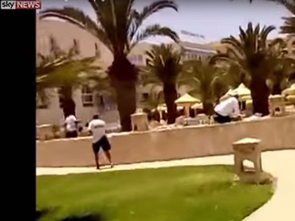 Footage shows hotel staff running through the grounds as shots and explosion are heard in the background