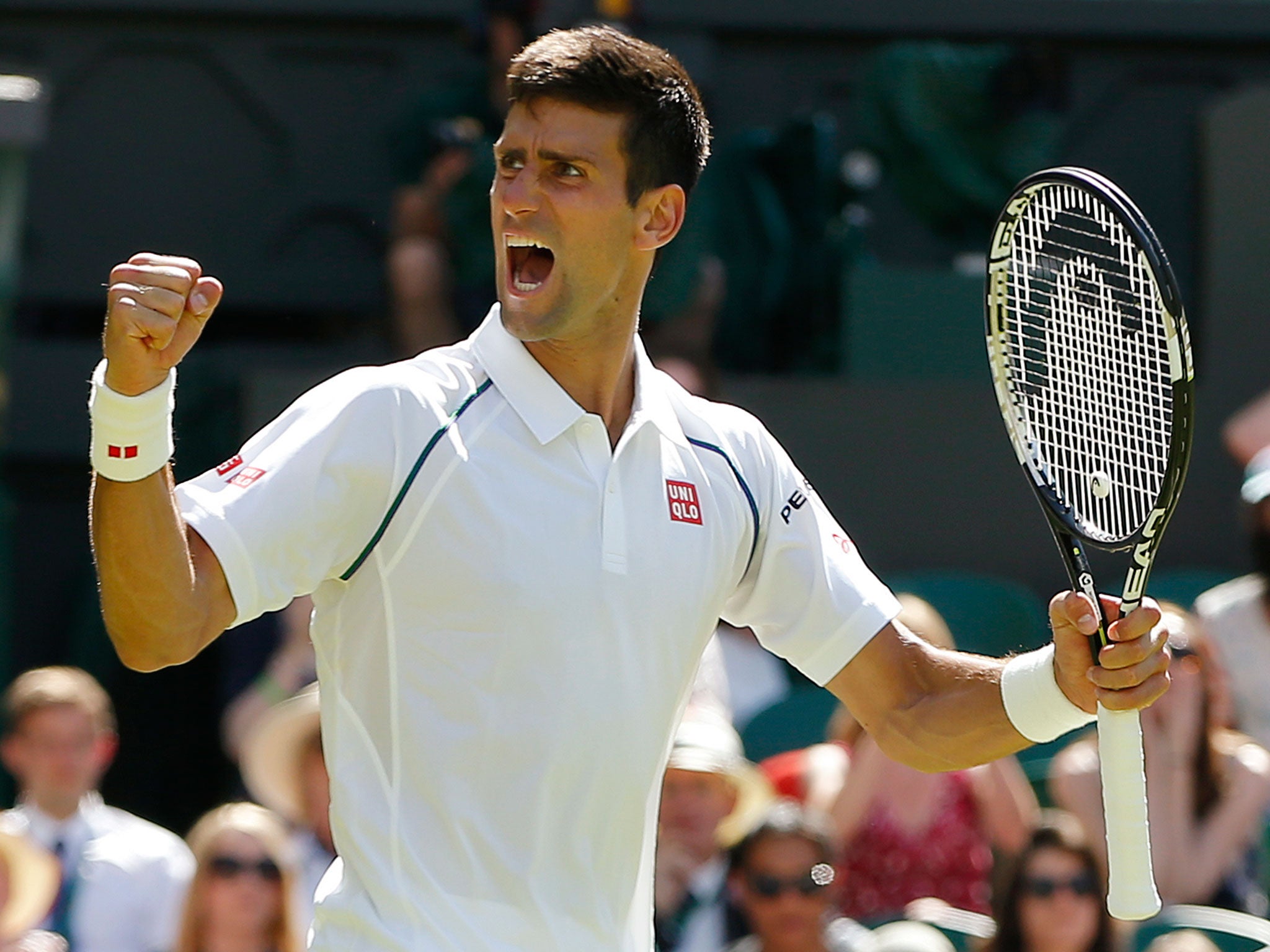 Serbia's Novak Djokovic celebrates winning the first round match at the Wimbledon Tennis Championships in London