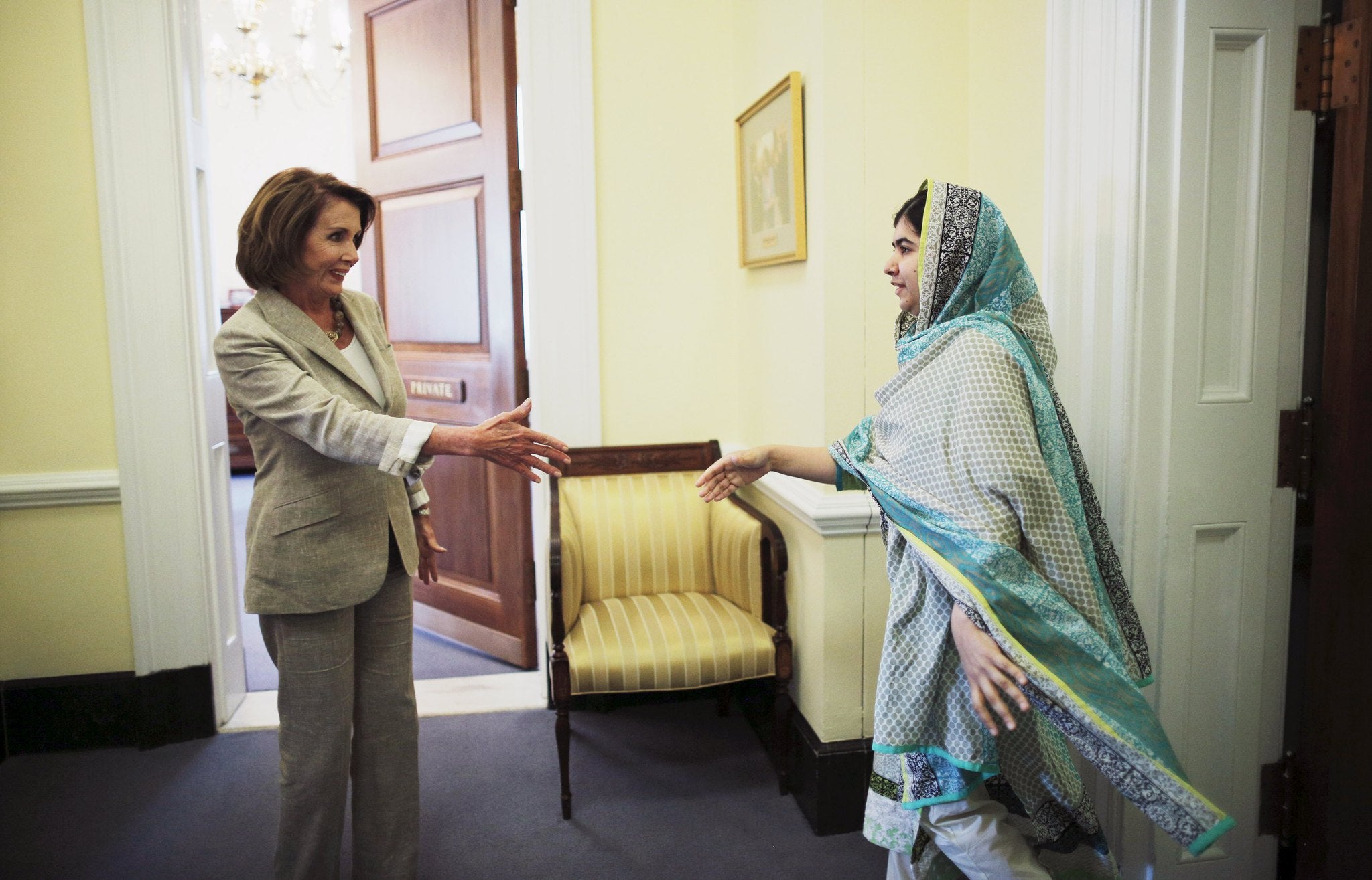 Malala walks to shake hands with U.S. House Minority leader, Nancy Pelosi, during her visit at Capitol Hill last week, where she spoke-out about the importance of education for girls